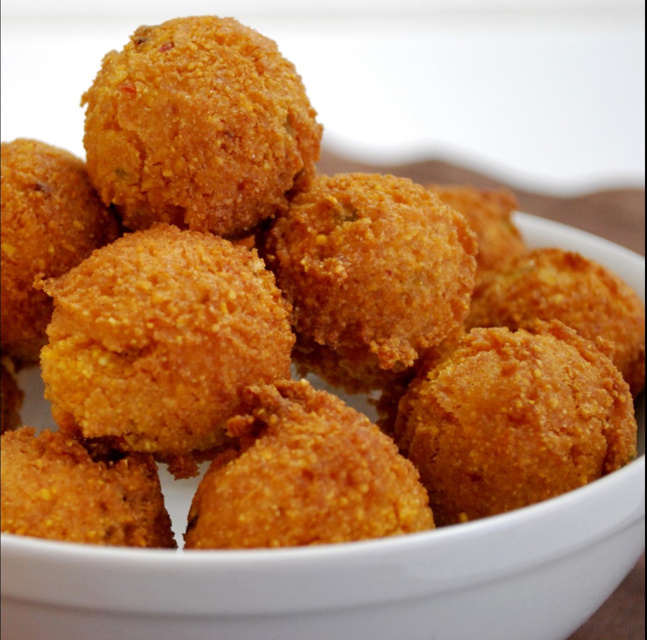 Order 12 Pieces Hush Puppies food online from Sharks Fish and Chicken store, Baltimore on bringmethat.com