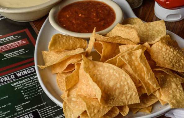 Order Queso Dip with Salsa food online from On Tap Sports Cafe store, Fultondale on bringmethat.com