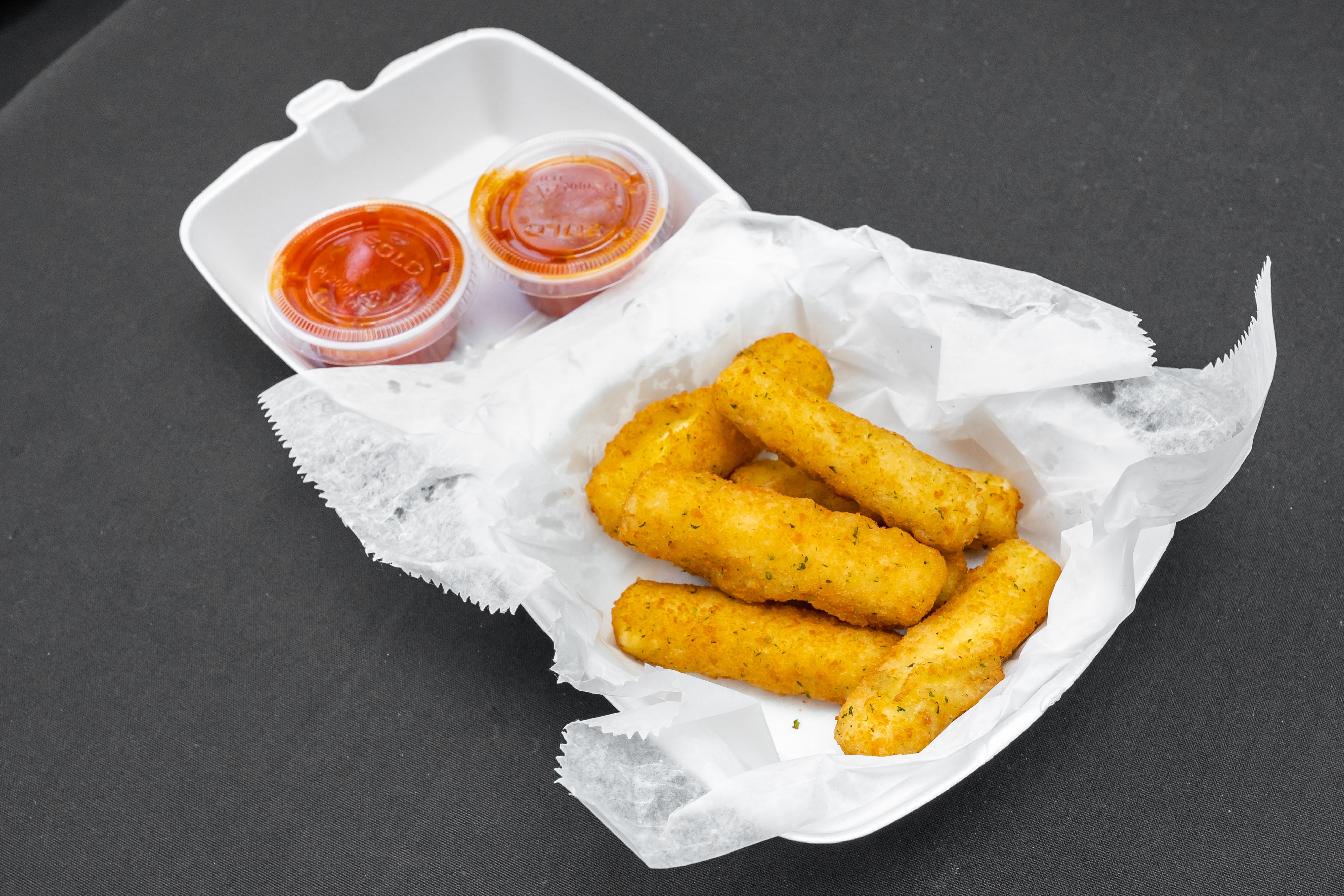 Order Mozzarella Sticks - Small (7 Pieces) food online from Eds Pizza House store, Philadelphia on bringmethat.com