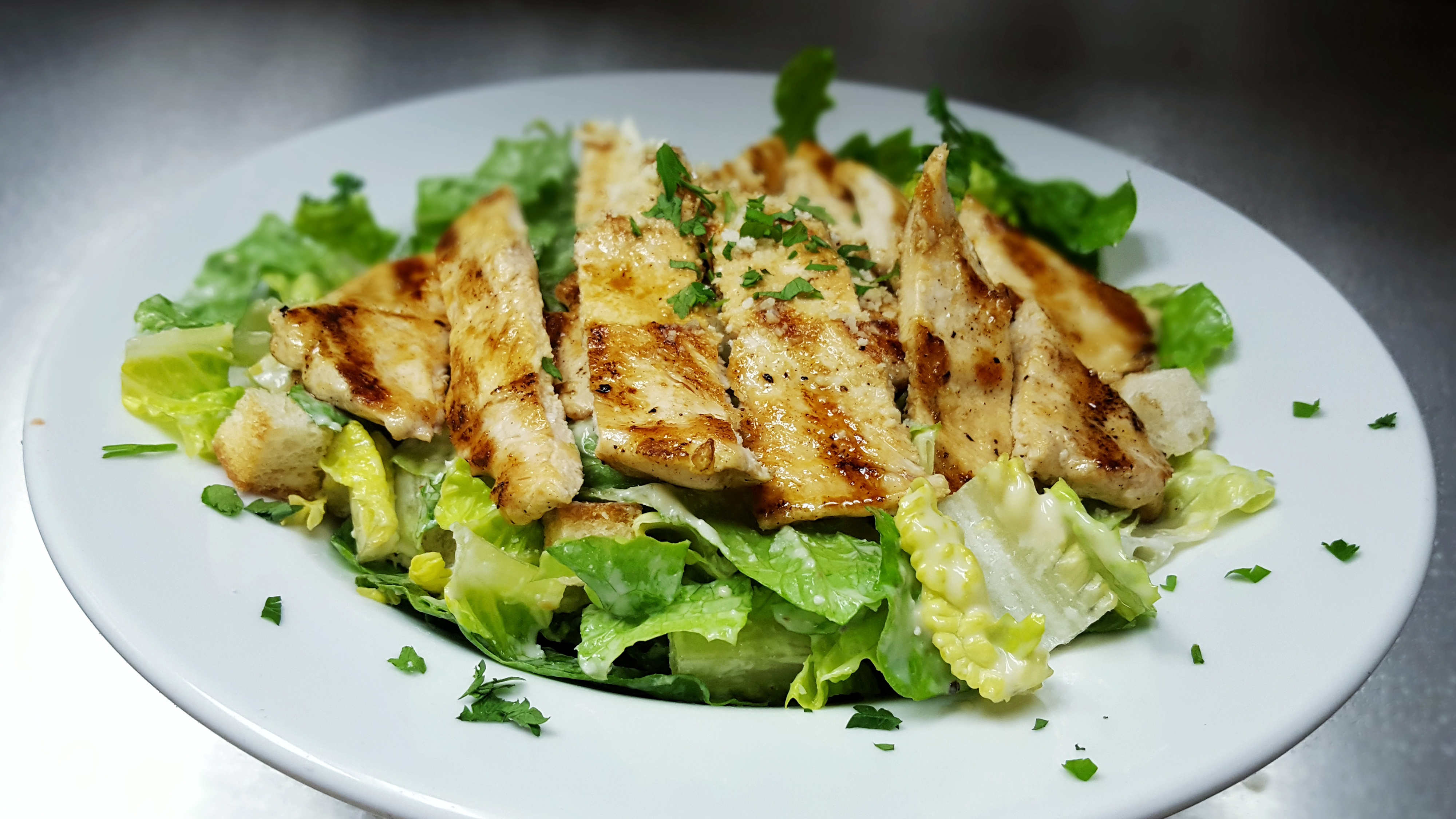 Order Chicken Caesar Salad food online from Marios Pizza Center & Restaurant store, Middlesex on bringmethat.com