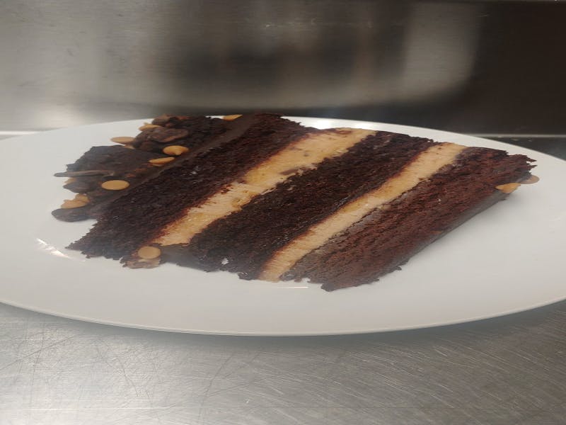 Order Mile High Peanut Butter Chocolate Cake - Dessert food online from Pizza Leone store, Fairfield on bringmethat.com