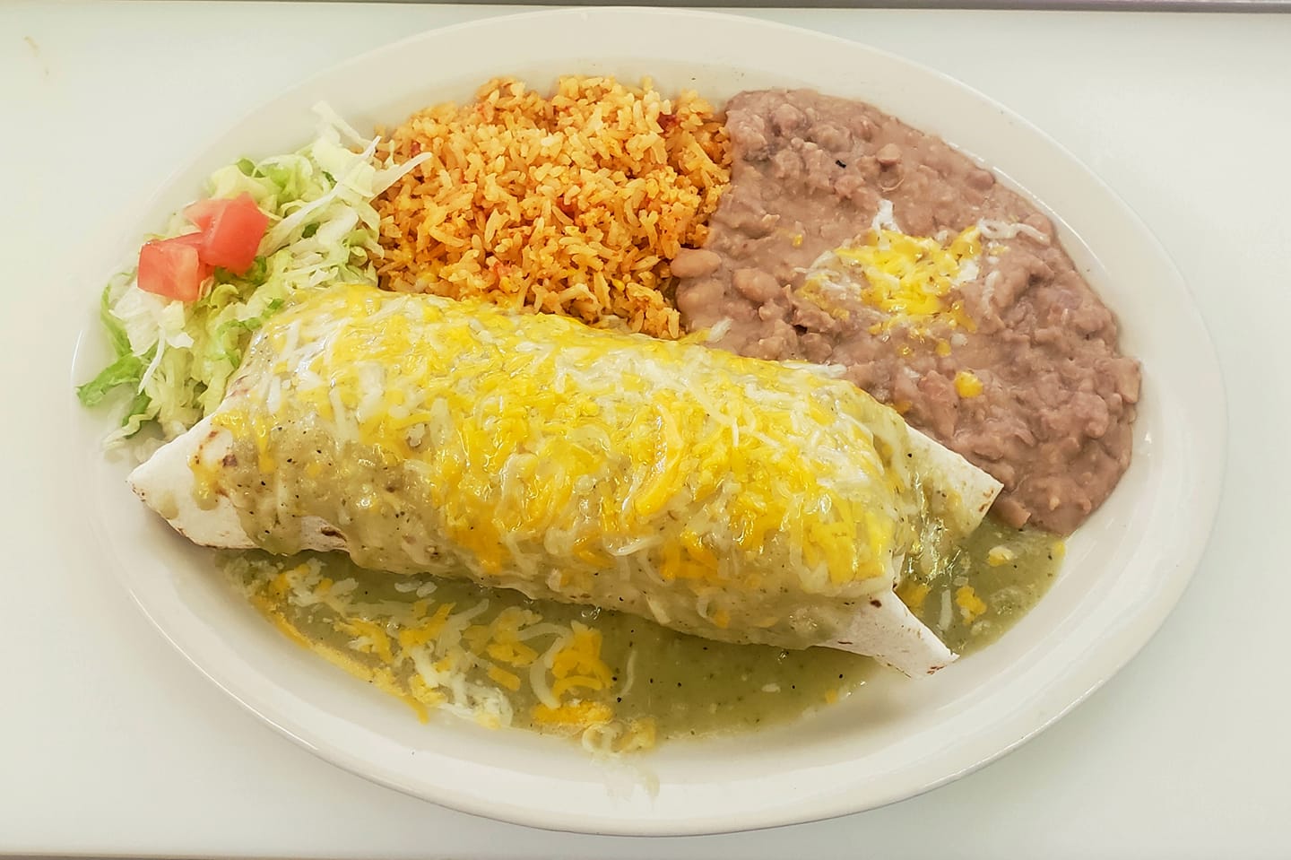 Order Green Chile Pork Burrito food online from El Jacalito store, Las Cruces on bringmethat.com