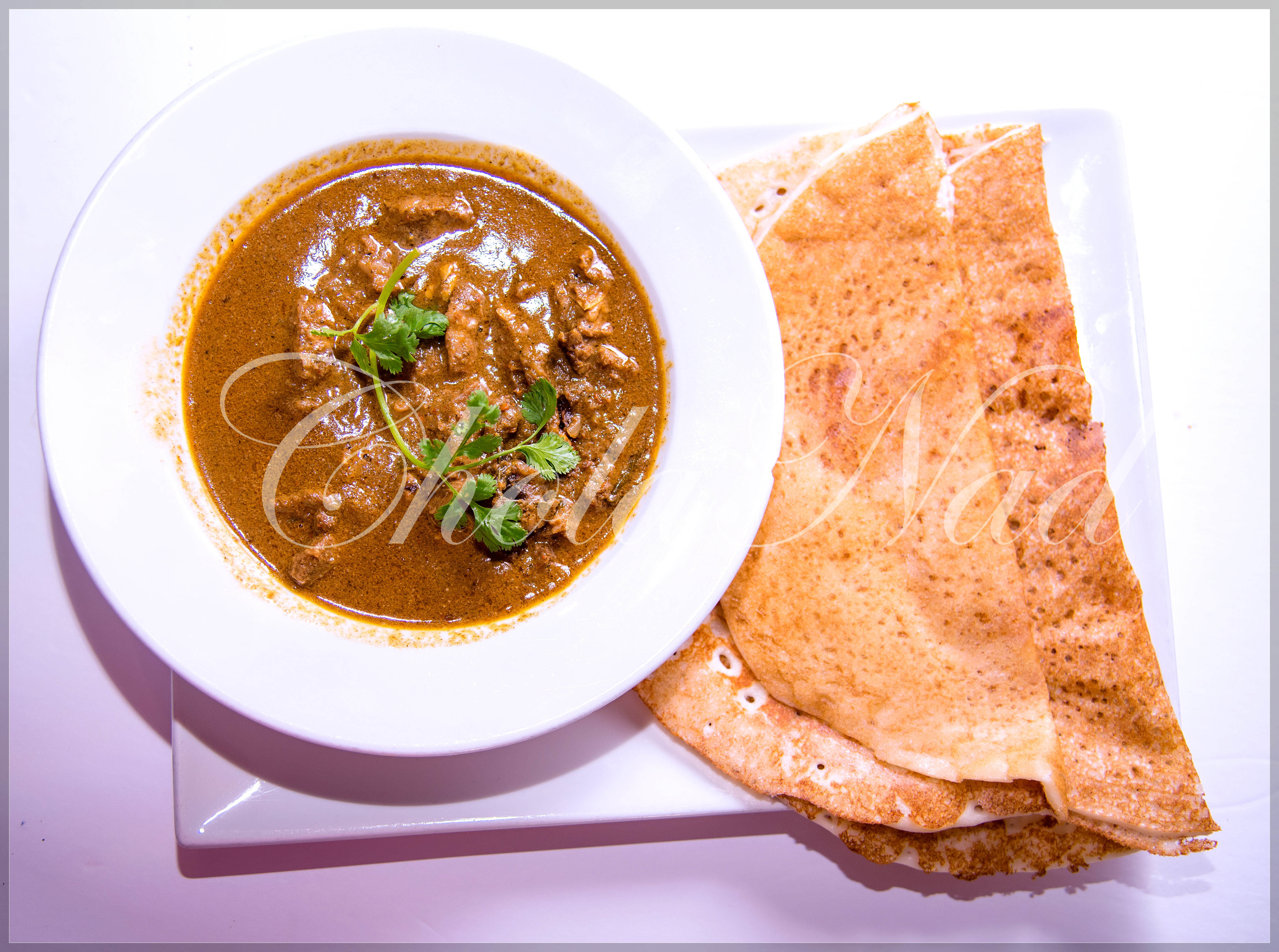 Order Ethnic Mutton Milagu Curry with choice of (Set Dosa or Egg Dosa or Parota) food online from Cholanad store, Chapel Hill on bringmethat.com