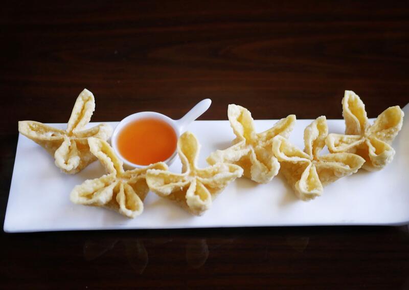 Order 6 Piece Crab Rangoon food online from Four Leaves Asian Restaurant store, Huntsville on bringmethat.com