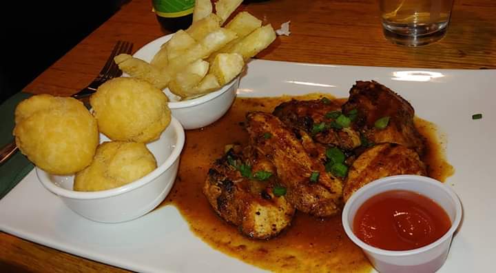 Order Boneless Chicken food online from Spice Island Grill store, Colorado Springs on bringmethat.com