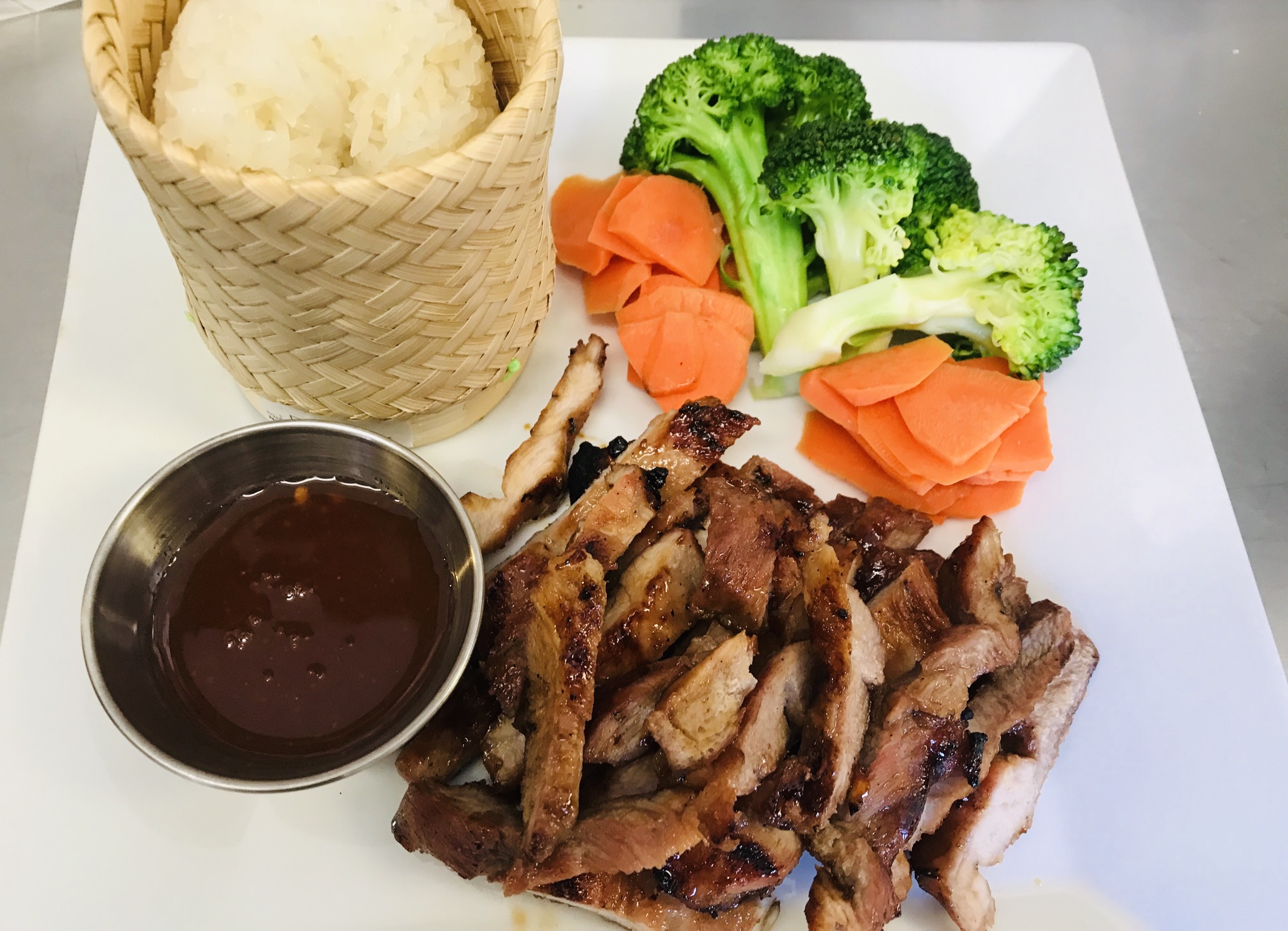 Order 44. BBQ Pork with Sticky Rice food online from Aroma Thai store, Santa Clarita on bringmethat.com