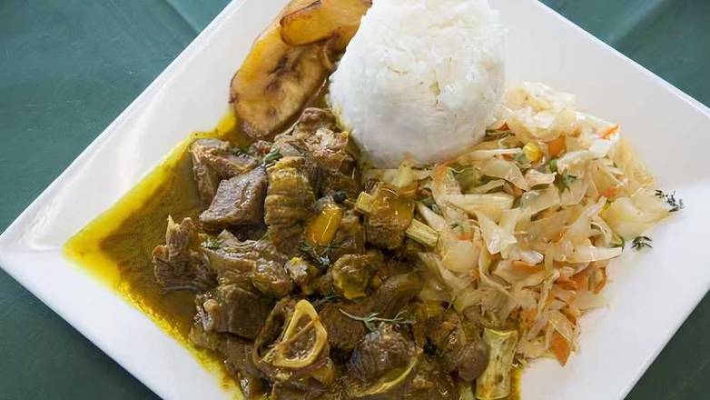 Order Curry Goat food online from Trappixx Jamaican Restaurant store, Cherry Hill on bringmethat.com