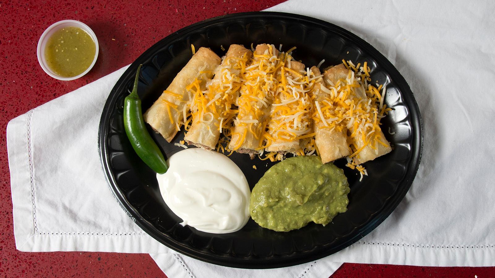 Order * 7 - Three Flautas + Rice & Beans food online from Burros & Fries store, Chula Vista on bringmethat.com