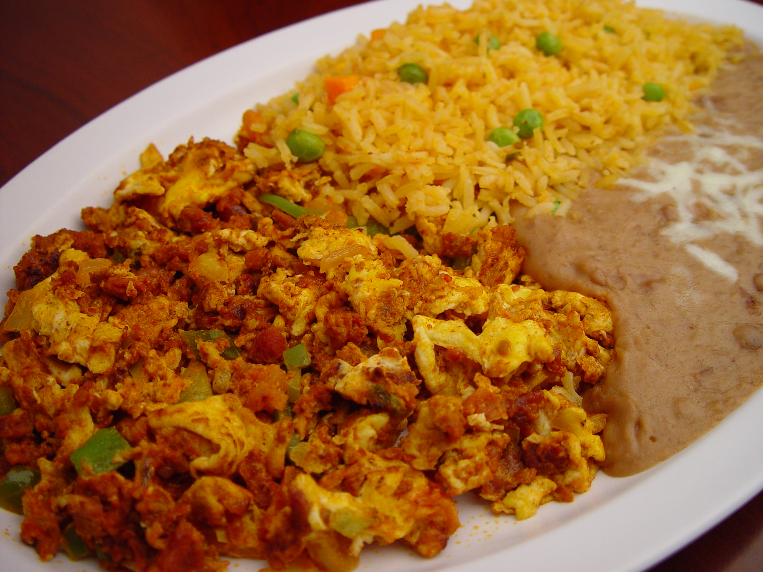 Order 13. Huevos con Chorizo food online from Rodeo Mexican Grill store, Los Angeles on bringmethat.com