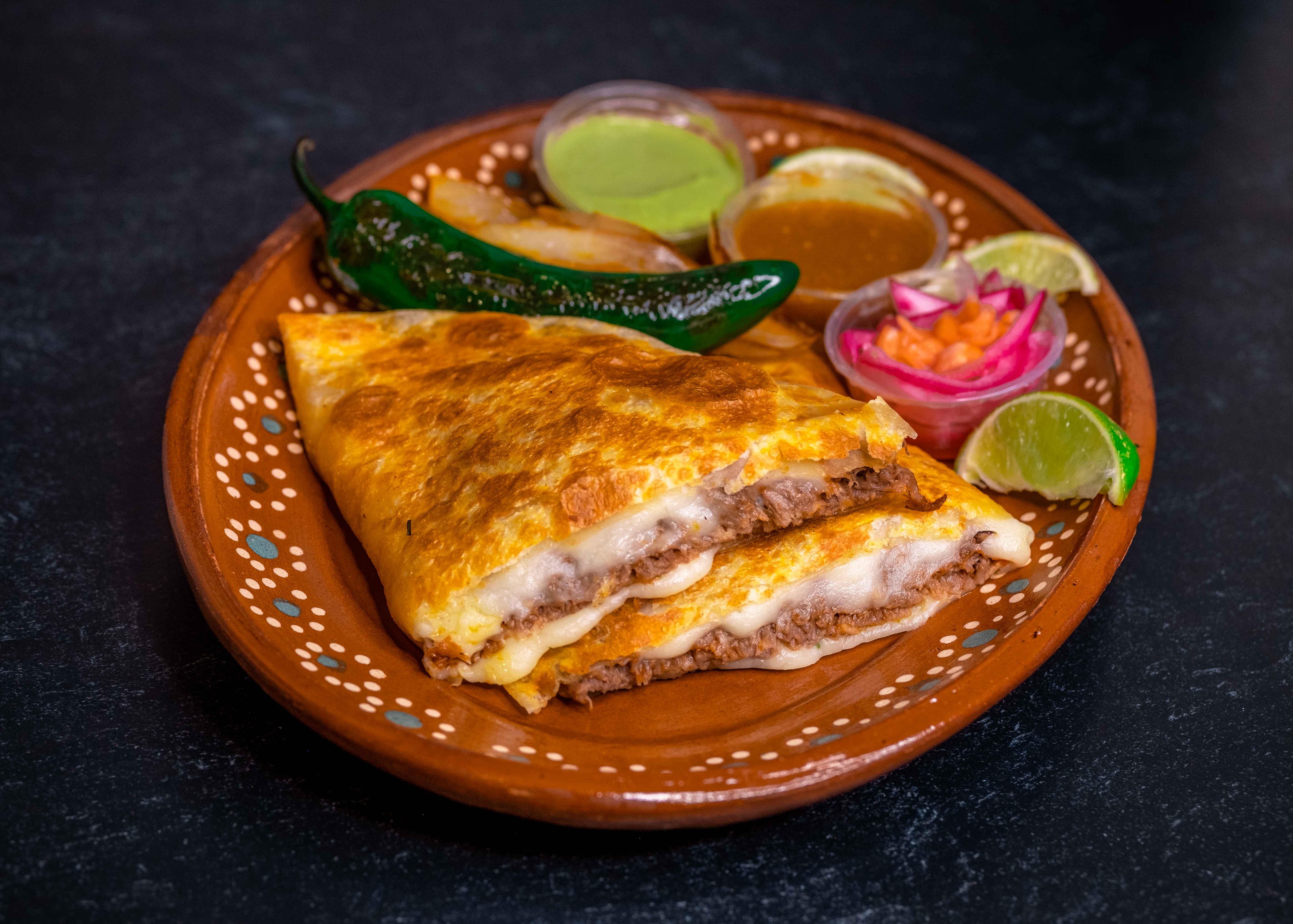 Order Quesadilla con Birria food online from Los Tapatios Taco Grill store, Salt Lake City on bringmethat.com