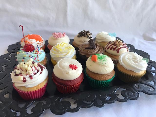 Order 1 Dozen Assorted Cupcakes food online from The Sweet Spot Bakery store, Fort Worth on bringmethat.com
