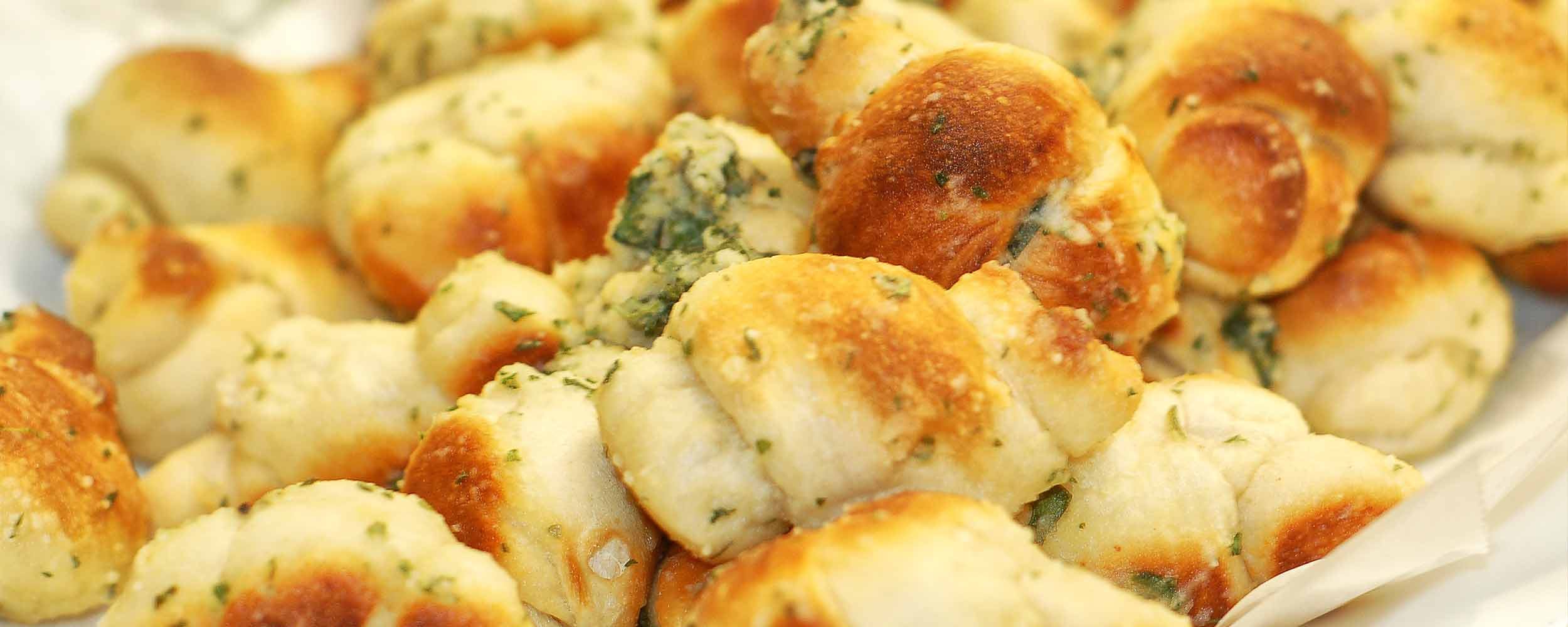 Order Garlic Knots - 4 Pieces food online from King of Pizza store, Berlin on bringmethat.com