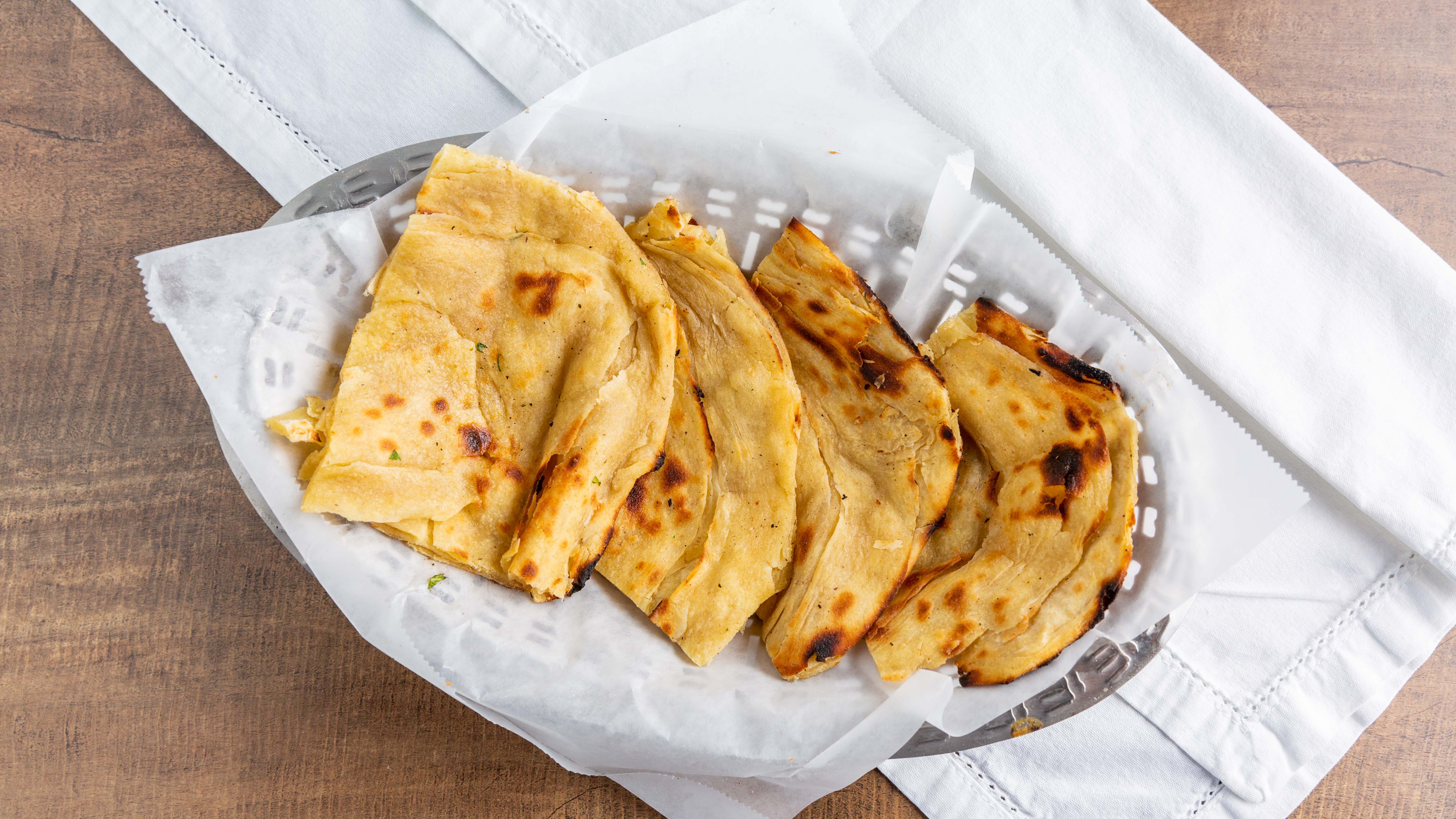 Order Laccha Paratha food online from Sattva Indian Rasoi store, Mission Viejo on bringmethat.com