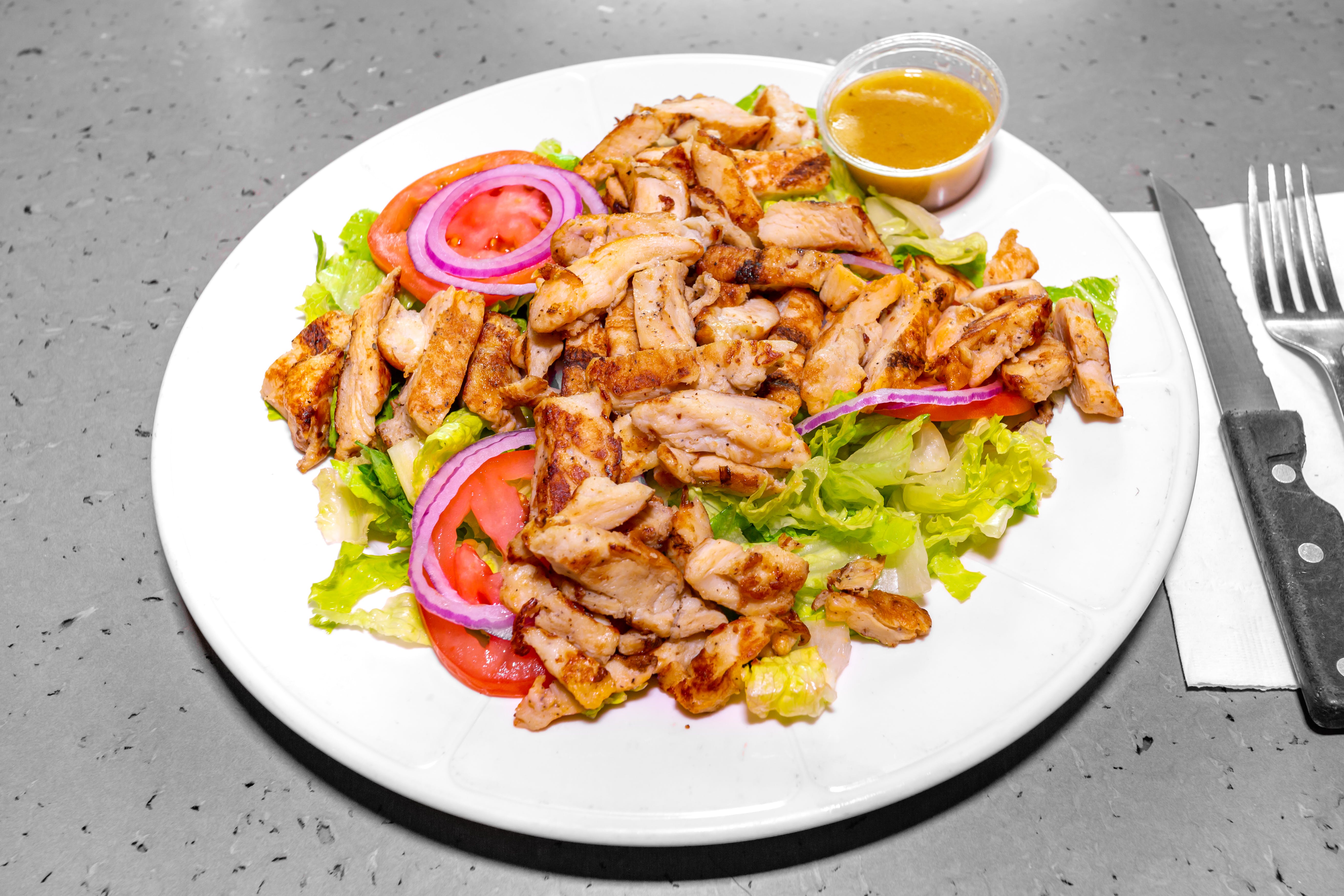 Order Grilled Chicken Salad - Salad food online from Nino Italian Restaurant store, Reading on bringmethat.com