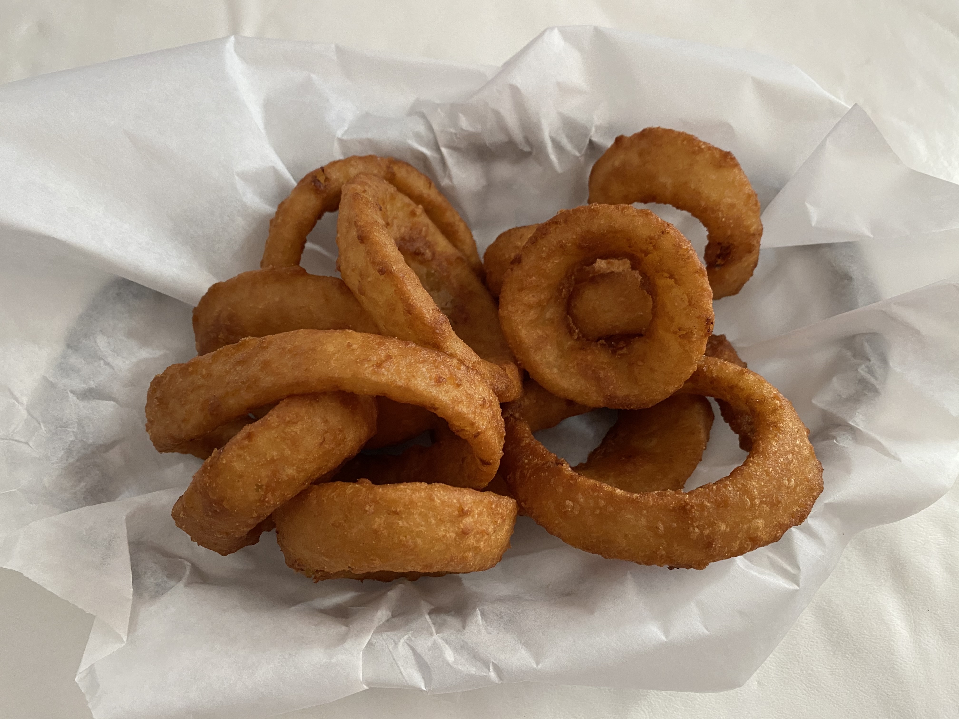 Order Thick Cut Onion Rings food online from Russell's Burgers store, Pasadena on bringmethat.com