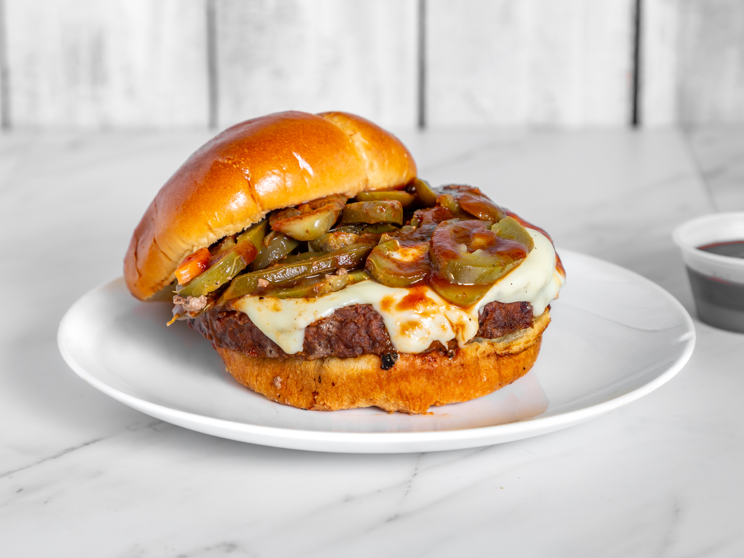 Order 1/2 lb The Big  XXX Hot N Spicy Jalapeno Burger food online from Burger Guys store, Kansas City on bringmethat.com