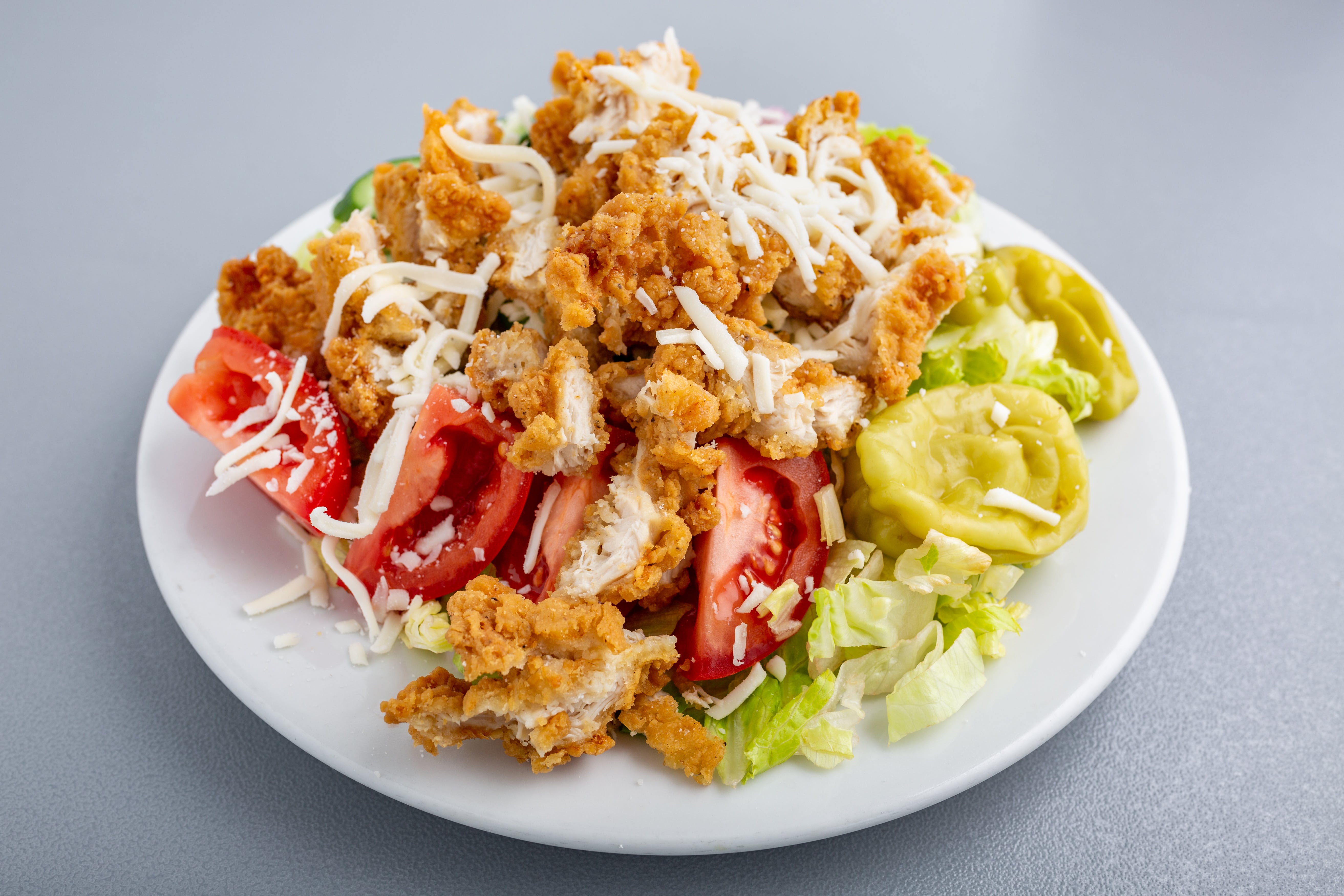 Order Crispy Chicken Salad - Salad food online from Napoli Pizza store, Henderson on bringmethat.com
