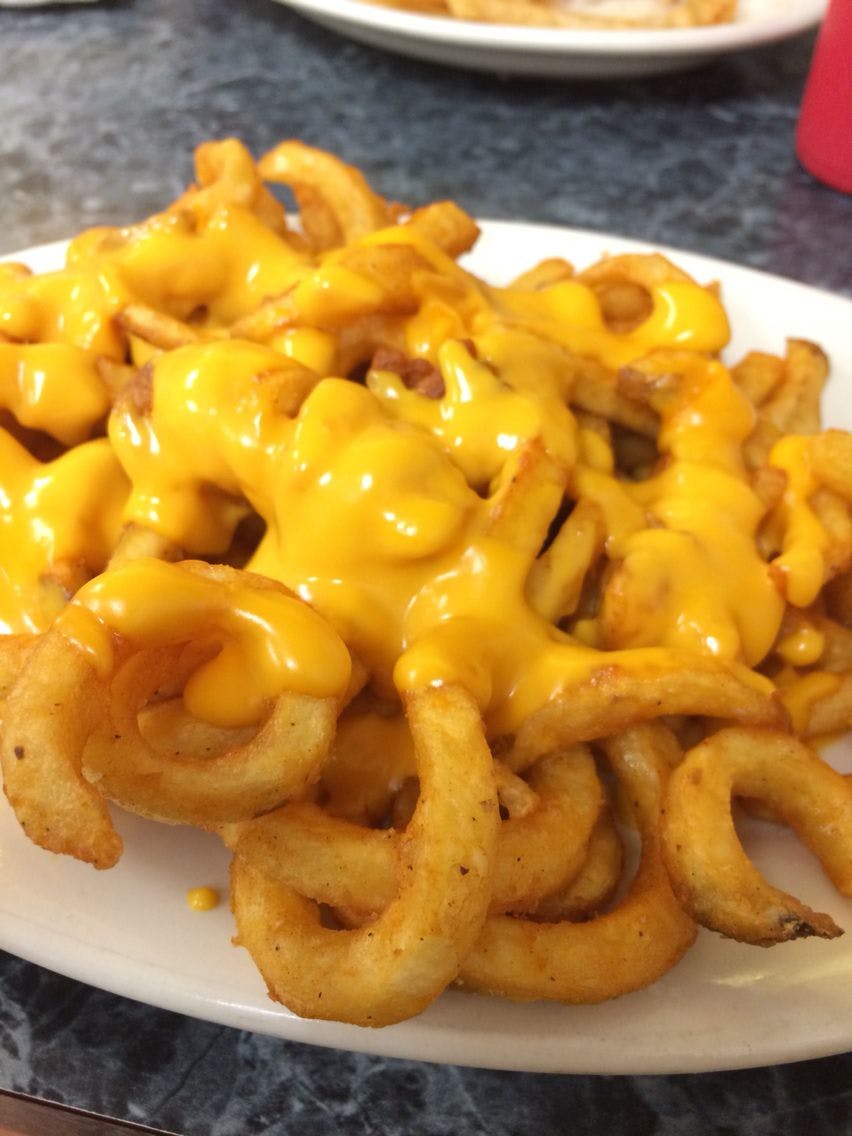 Order Curly Cheese Fries - Appetizer food online from Amigos Restaurant & Pizza store, Cheltenham on bringmethat.com