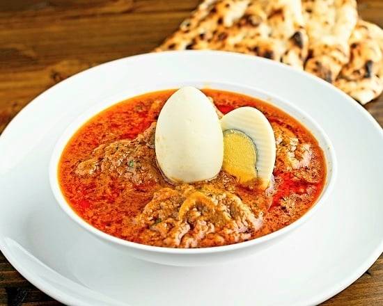 Order Aga's Goat Curry food online from Aga Restaurant & Catering store, Houston on bringmethat.com