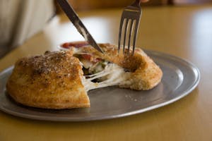 Order Double Cheese Calzone food online from Massino's Pizzeria store, Aurora on bringmethat.com