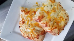 Order Stuffed Cheesy Bread Sticks food online from Papa Ray's Pizza - Miriam St. store, Daly City on bringmethat.com