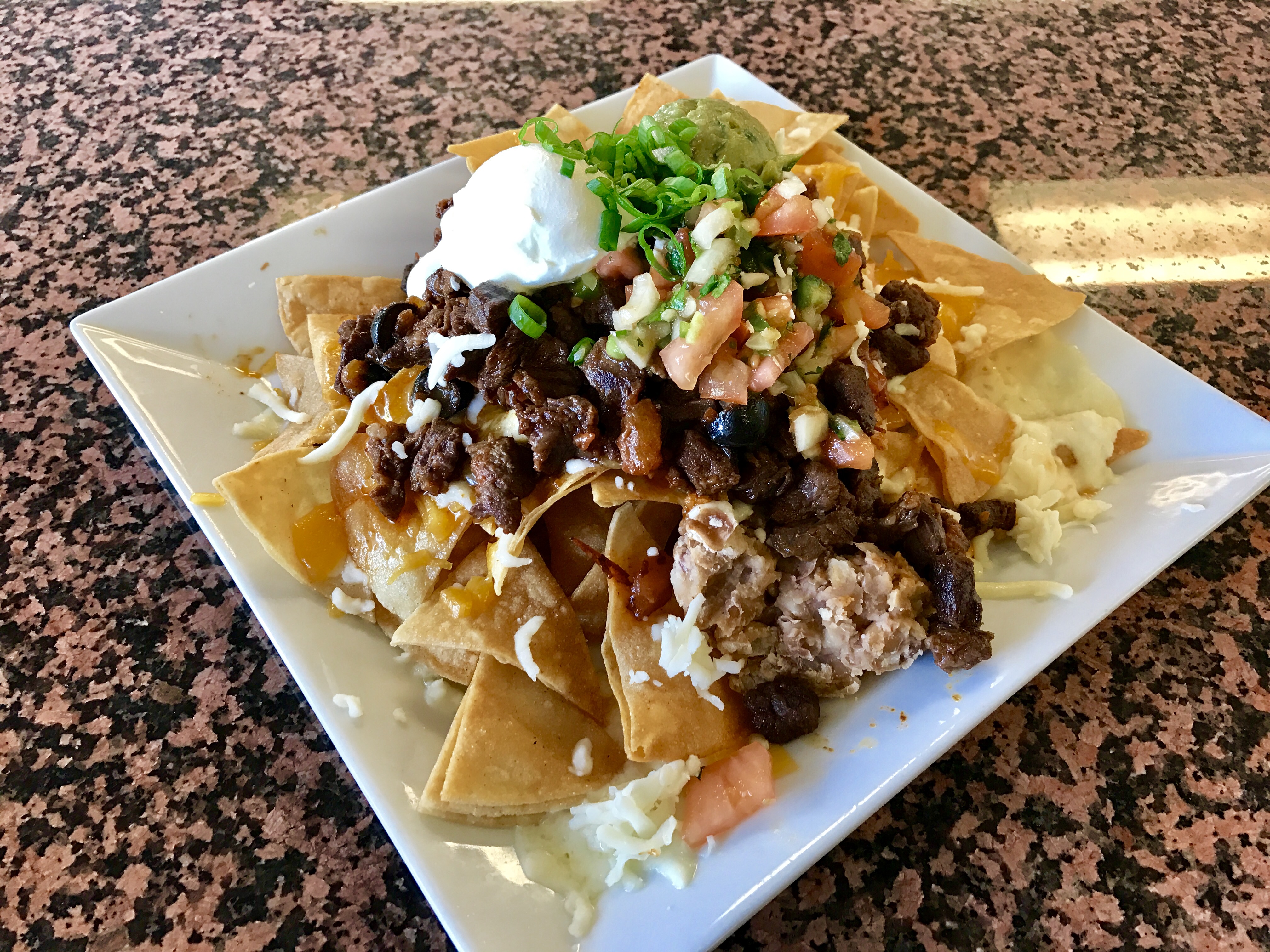Order Nachos Supreme  food online from Famous Label’s Delicatessen store, Los Angeles on bringmethat.com