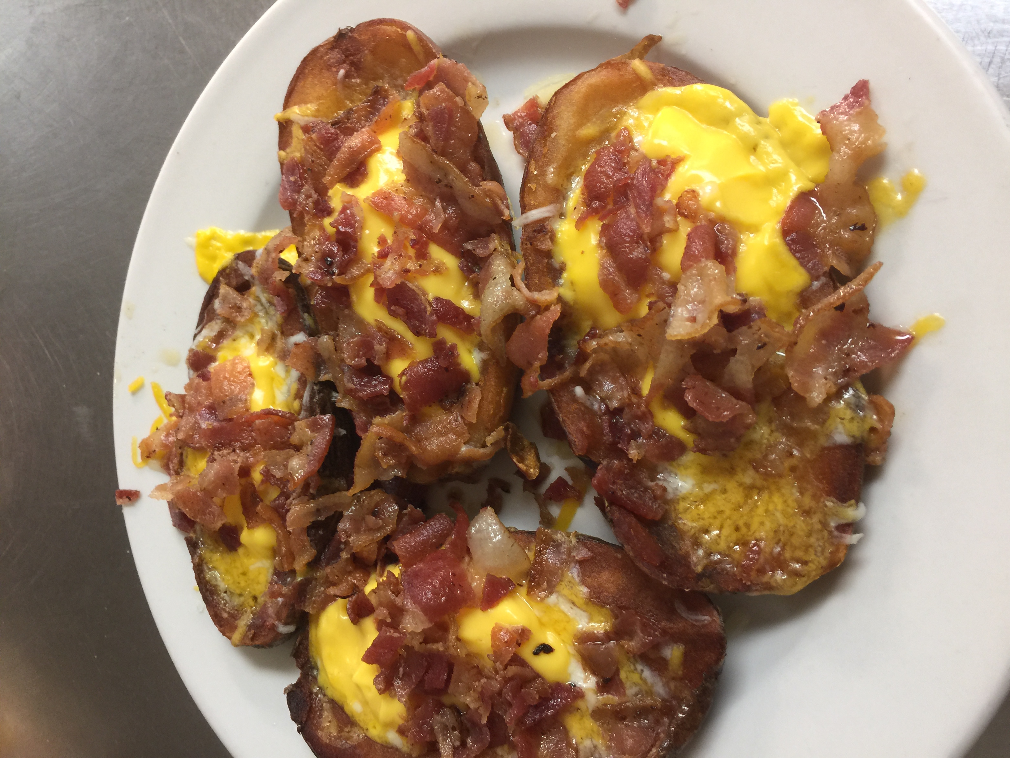 Order 4 Loaded Potato Skins food online from Homestyle Grille store, Bartonville on bringmethat.com