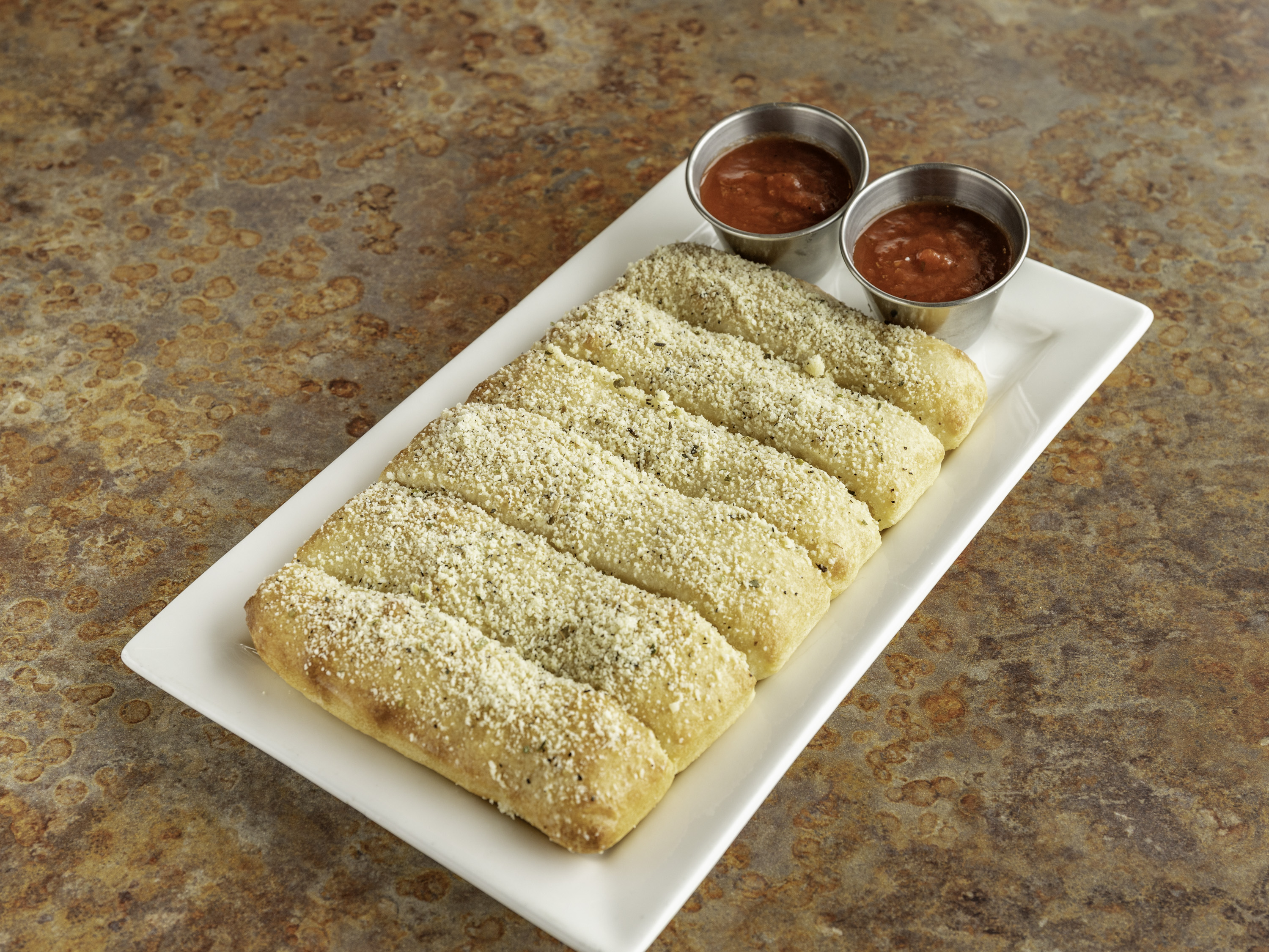 Order Breadsticks food online from Carmelos Italian Pizza store, Caledonia on bringmethat.com