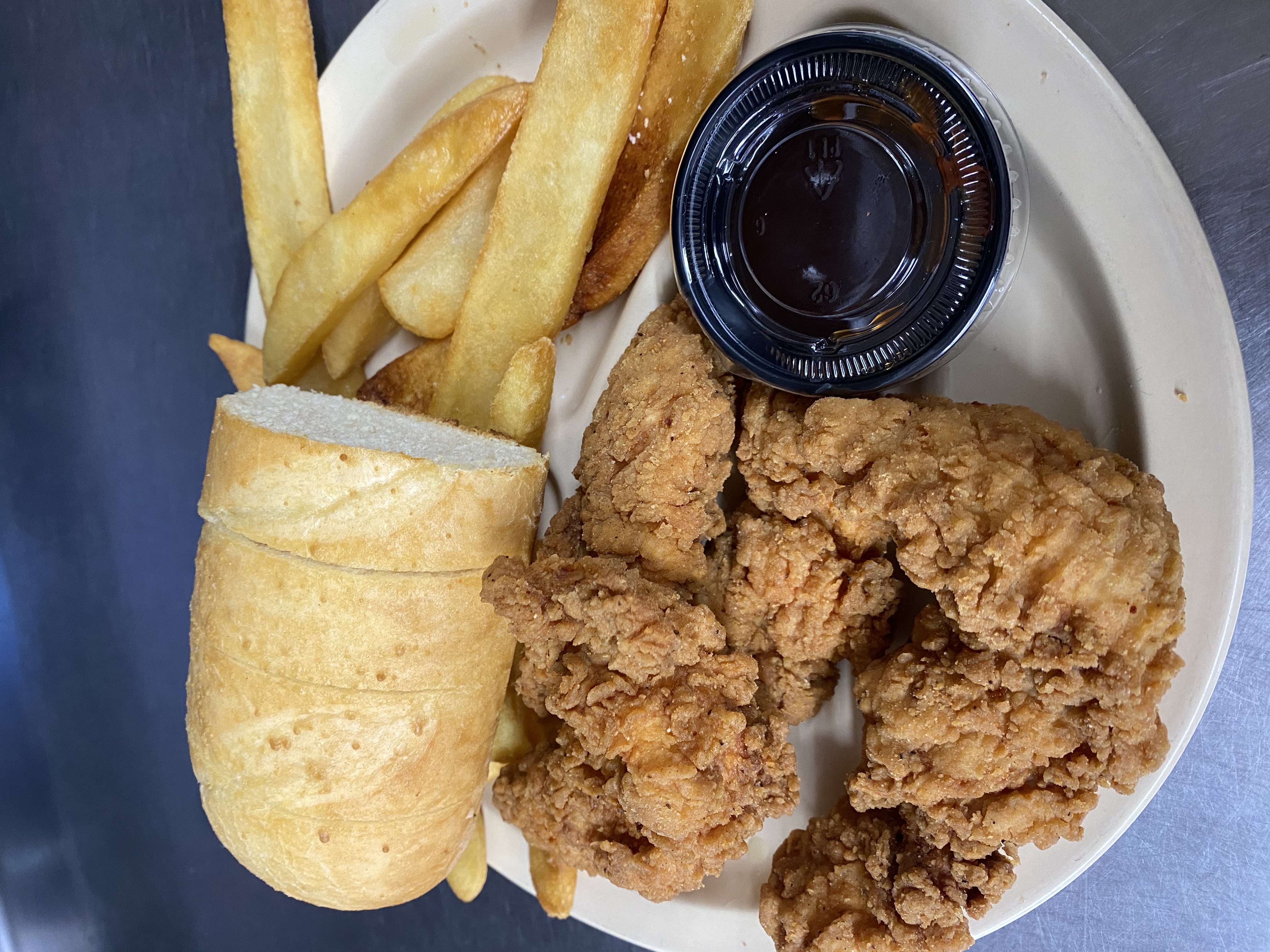Order 4 Chicken Breast Strips Basket food online from Angilo's Pizza store, Louisville on bringmethat.com