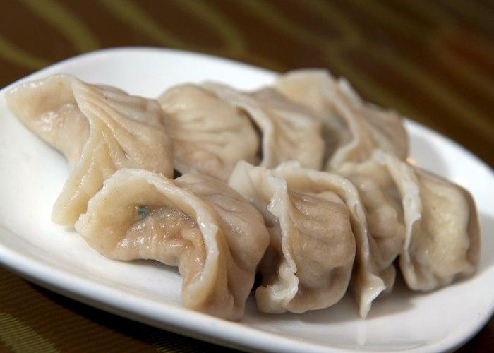 Order 9. Gently Steamed Dumpling food online from China Express store, Arlington on bringmethat.com
