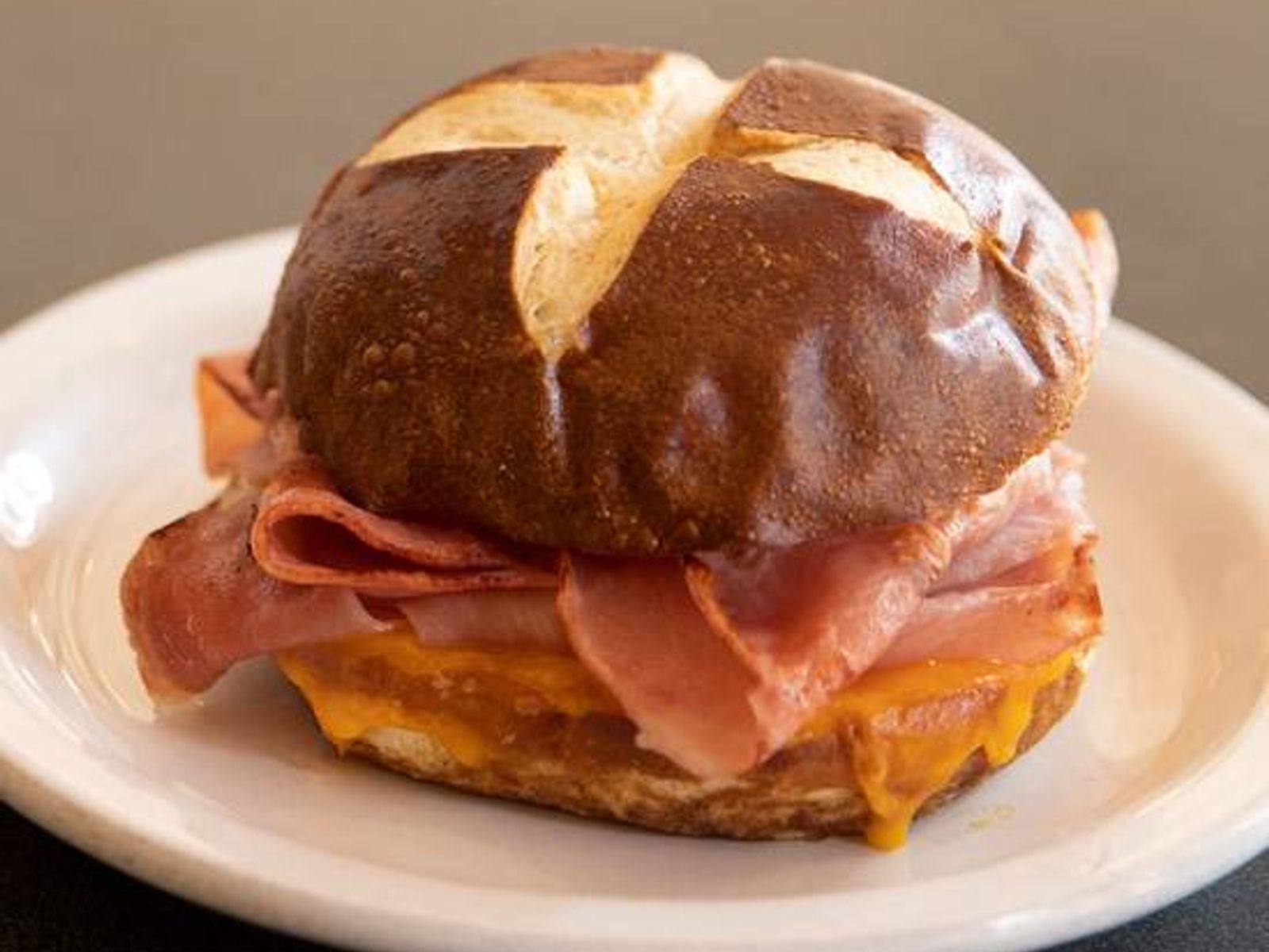 Order Ham & Cheddar Pretzel Sandwich food online from Sweetwaters Coffee & Tea store, Shelby Charter Township on bringmethat.com
