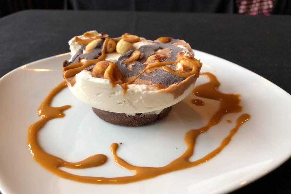 Order Snickers Keto Cheesecake food online from Dolce Vita World Bistro store, Syracuse on bringmethat.com