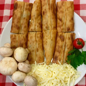 Order Mushroom and Cheese Pide food online from Magic Bites Bakery store, Arlington on bringmethat.com
