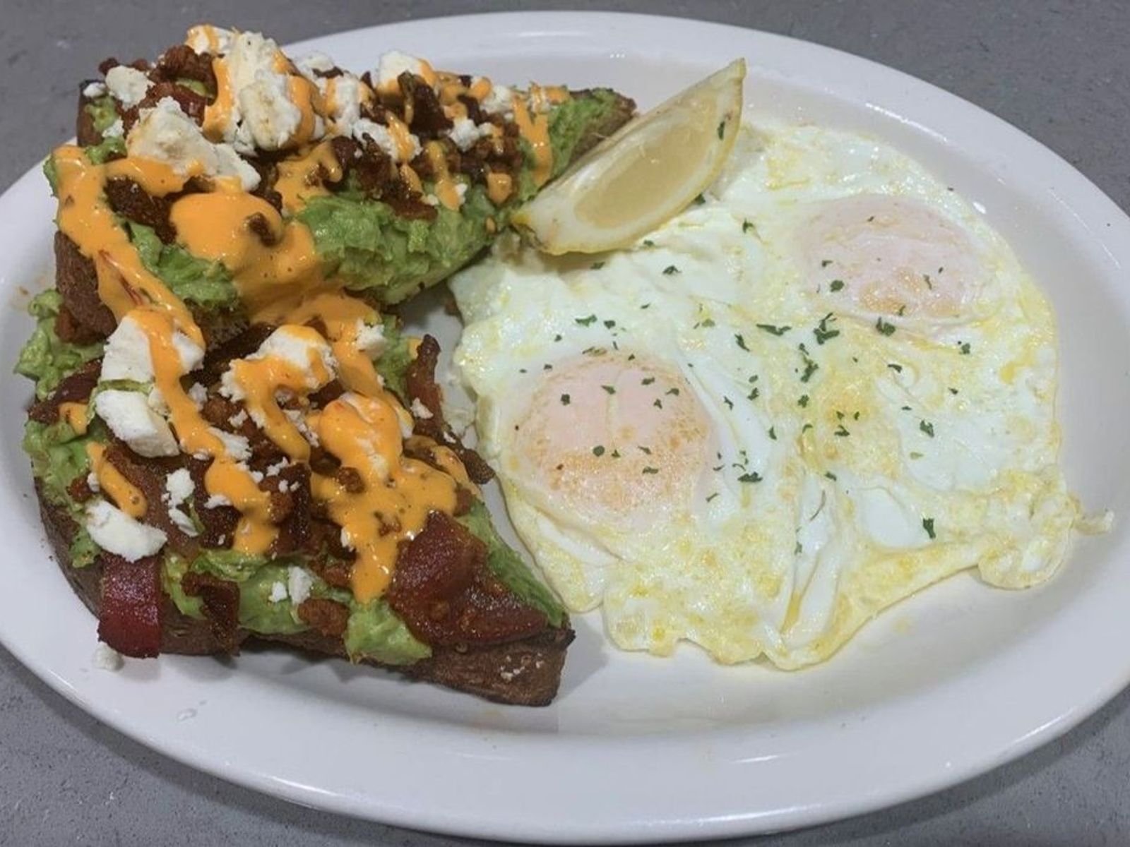 Order BOOM BOOM Avocado Toast - OO food online from Biscuits Cafe store, Chandler on bringmethat.com
