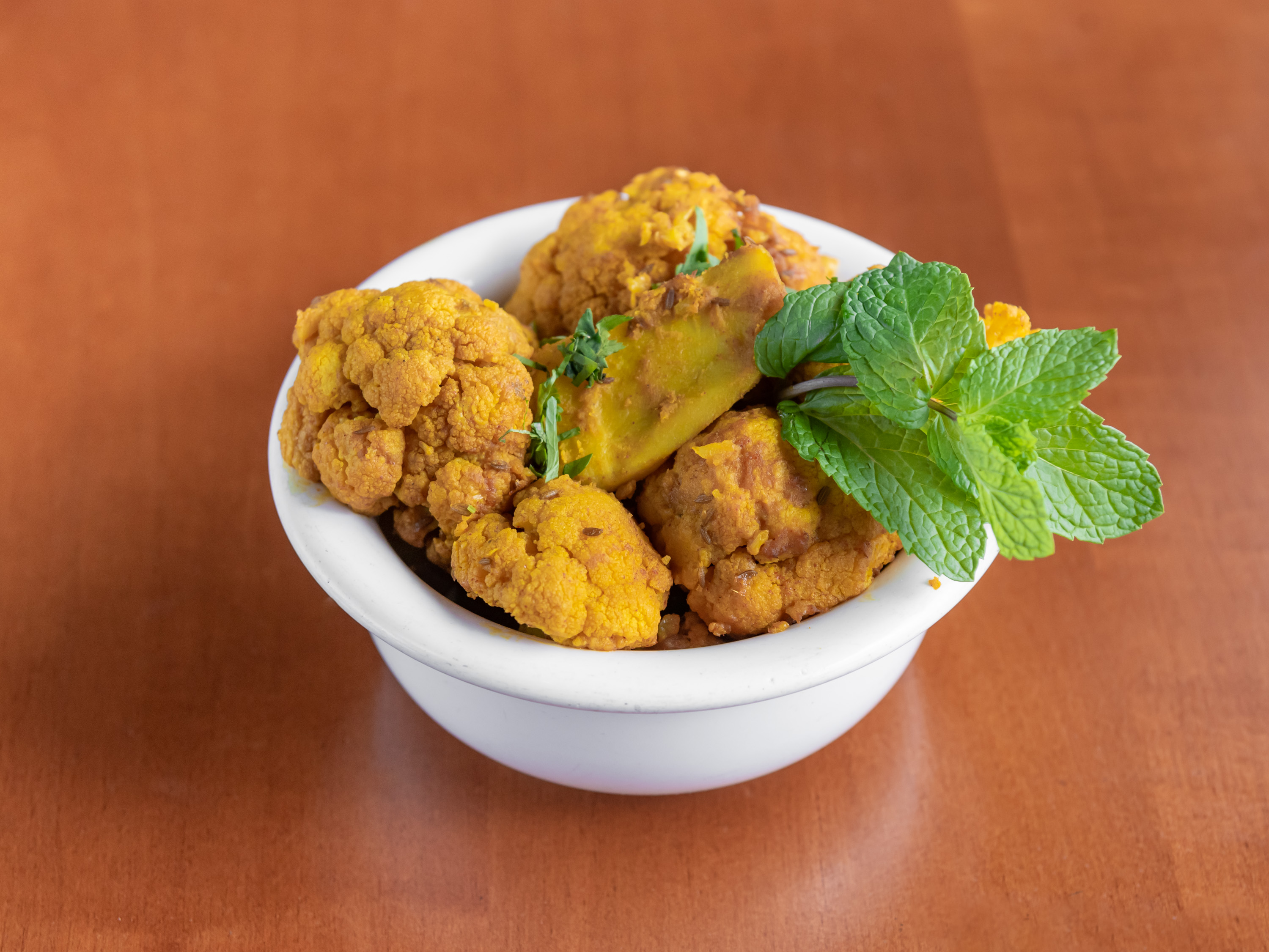 Order Aloo Ghobhi food online from Taste of India Sherman Oaks store, Sherman Oaks on bringmethat.com