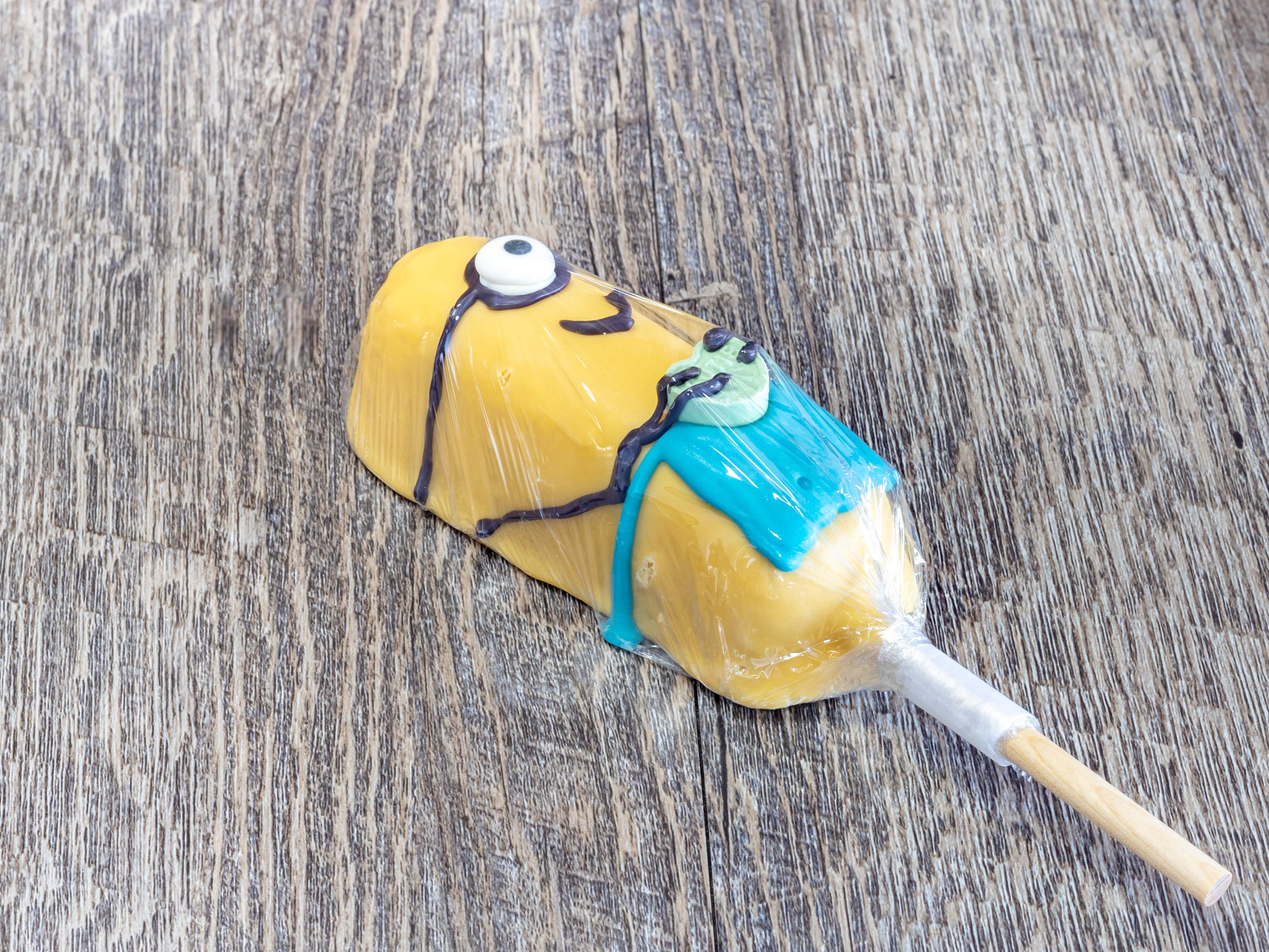 Order Dipped Twinky -Minion Blue food online from Rocky Mountain Chocolate Factory store, Houston on bringmethat.com