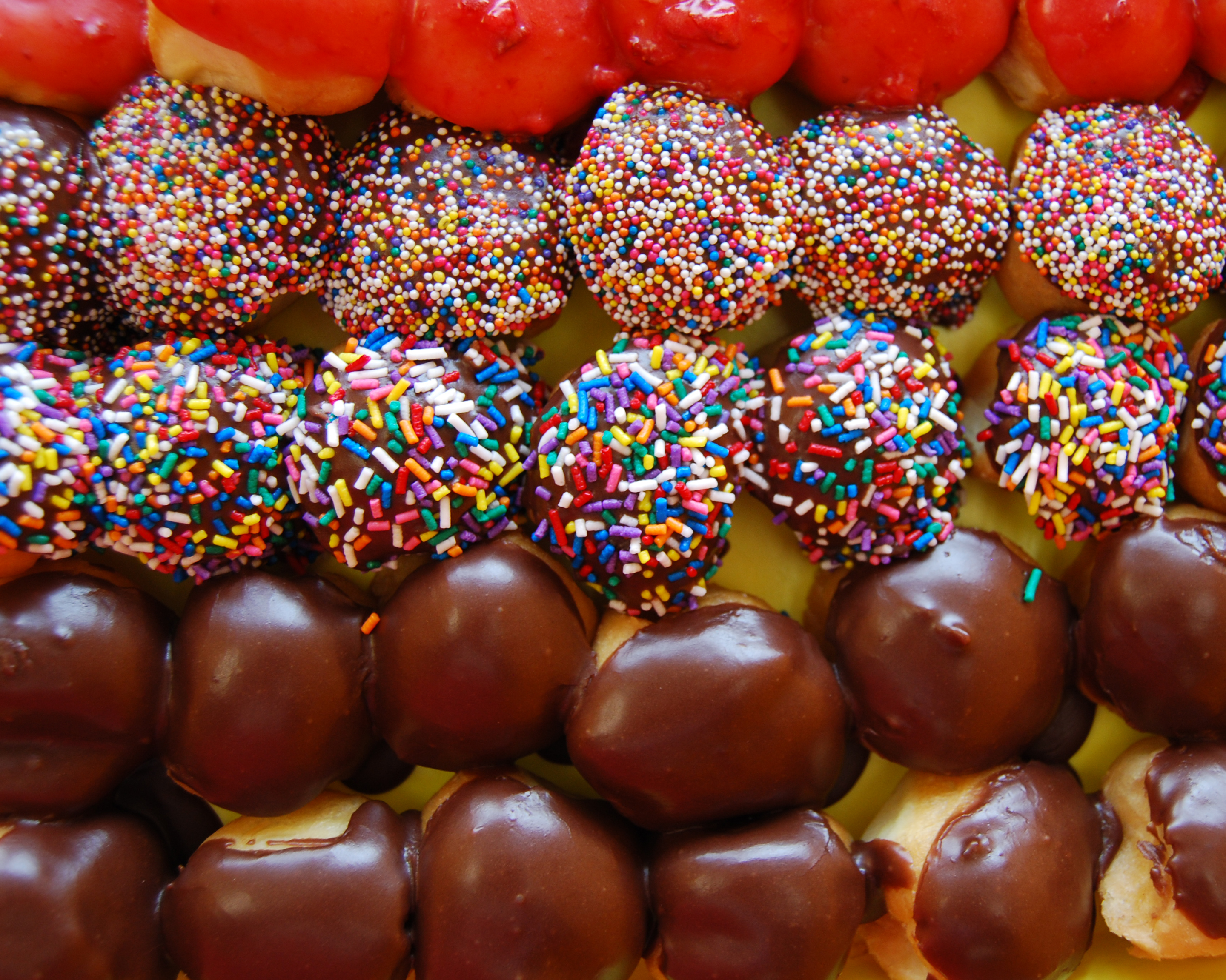 Order 1 Dozen Chocolate Holes Donut food online from Jaram's Donuts store, Dallas on bringmethat.com
