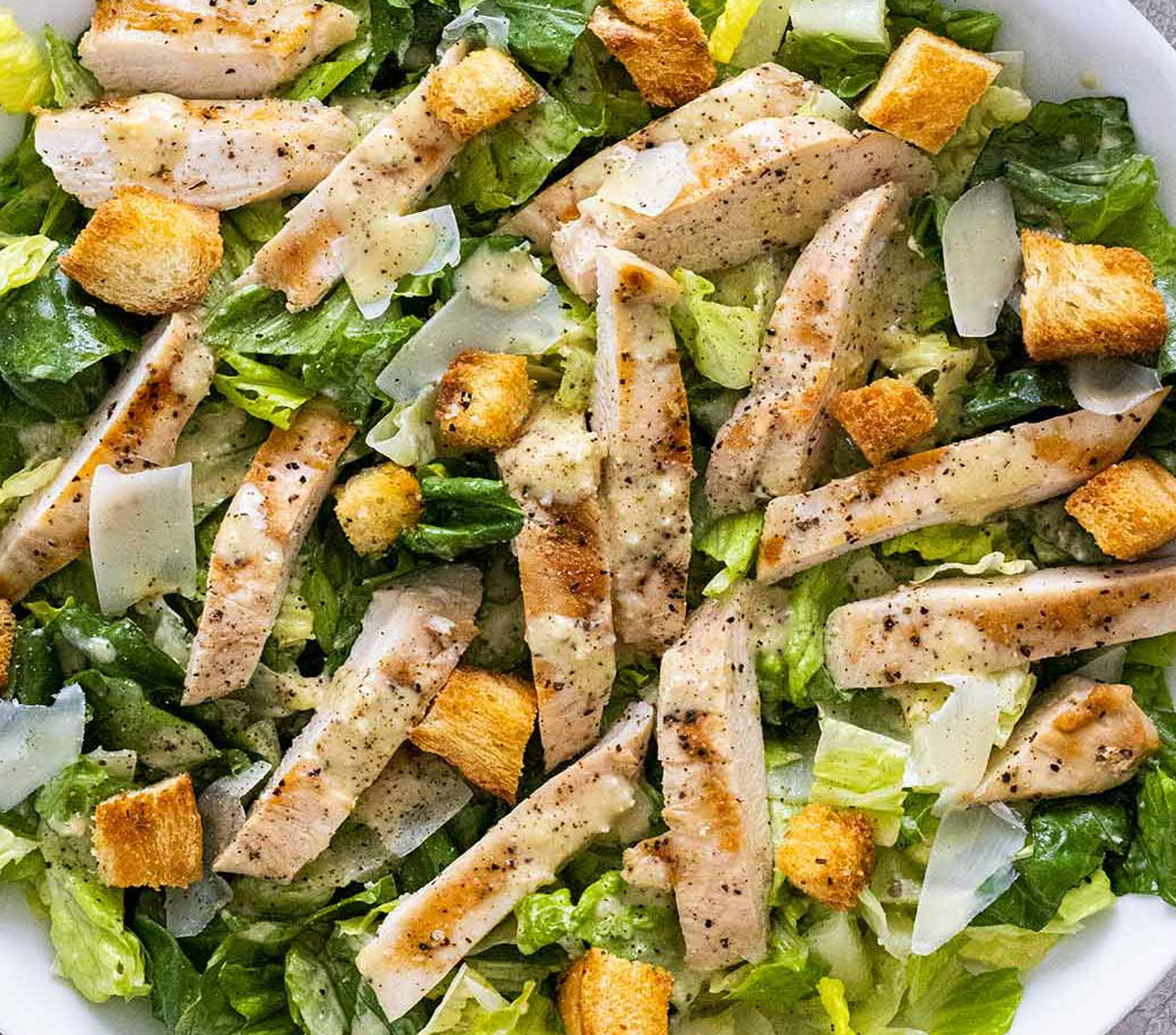 Order Caesar Salad with Grilled Chicken  food online from Pinocchio In The Desert store, Palm Springs on bringmethat.com