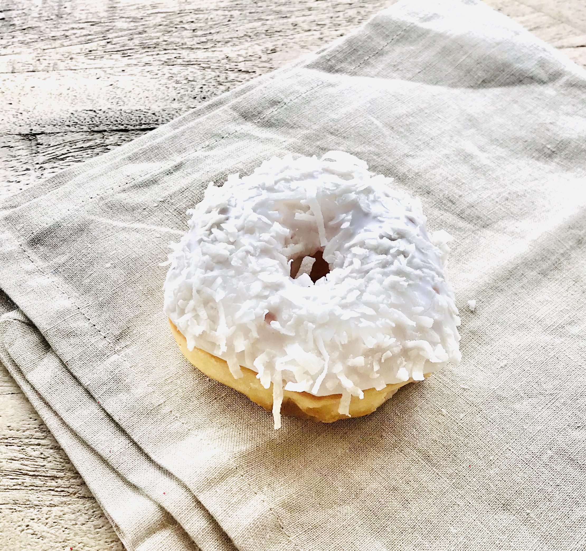 Order White Coconut donut  food online from Donna Donuts store, Keller on bringmethat.com