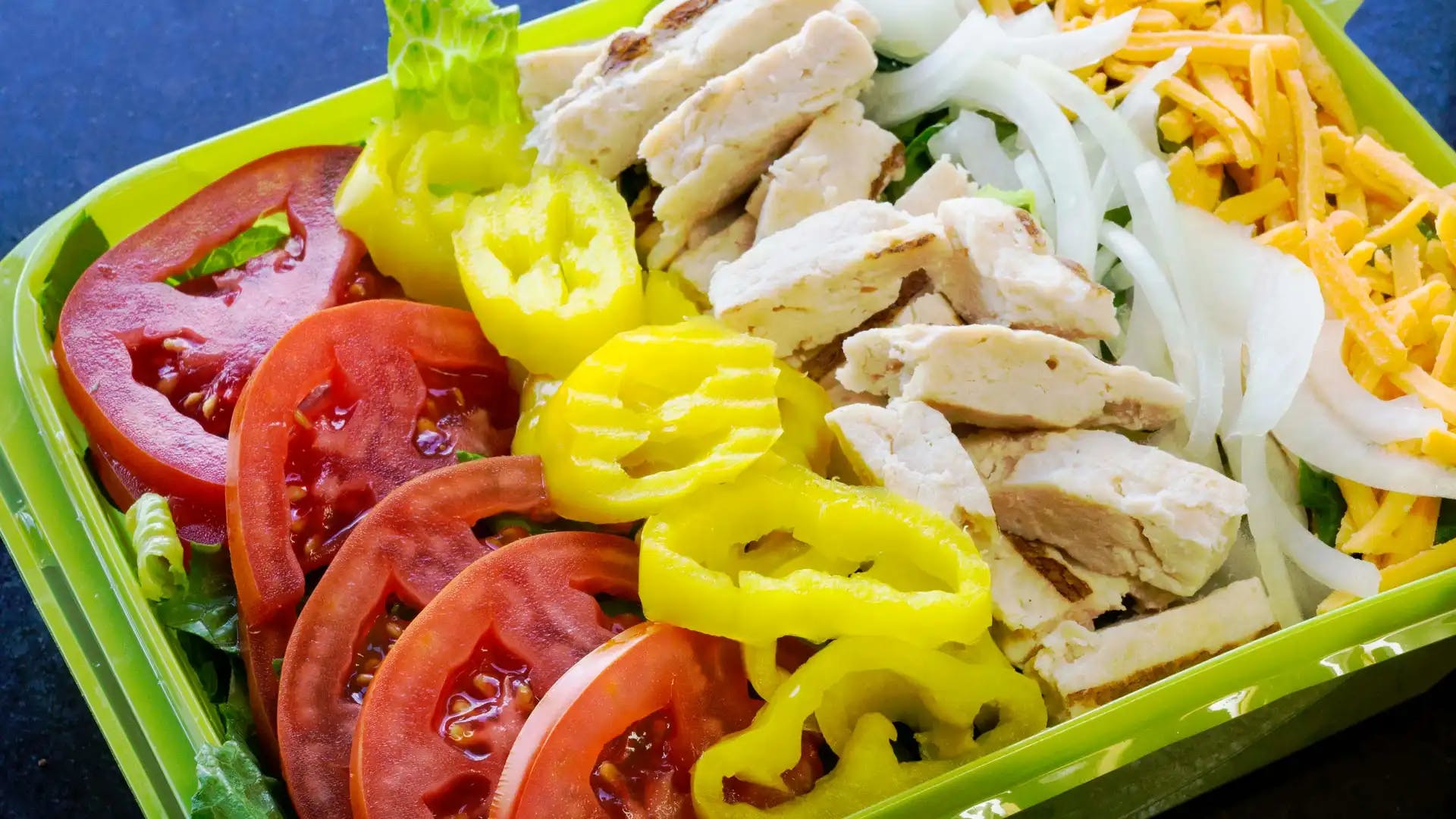Order Grilled Chicken Salad - Salad food online from Tubby's Grilled Submarines store, Westland on bringmethat.com
