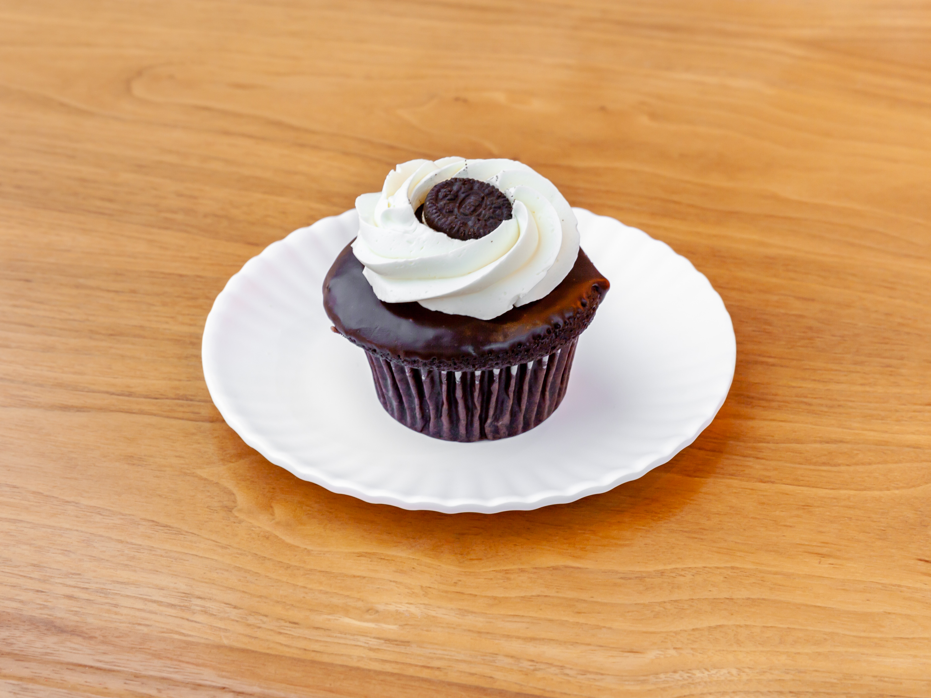 Order Cookies-N-Cream Cupcake food online from Molly Cupcakes store, Orland Park on bringmethat.com
