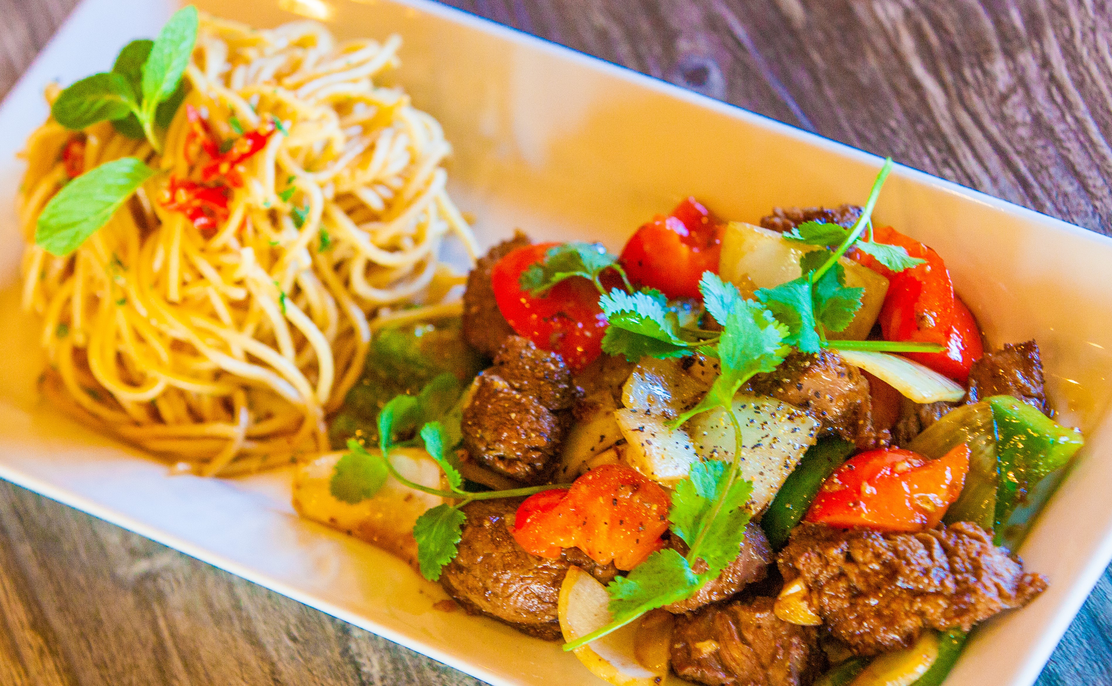 Order Garlic Noodles with Shaking Beef Filet Mignon food online from Pho Tick Tock store, San Jose on bringmethat.com