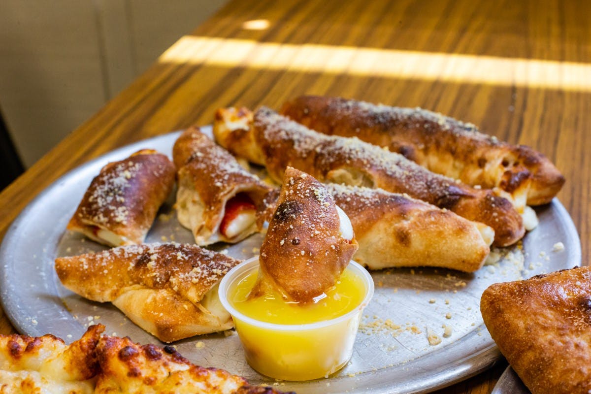 Order Stuffed Breadsticks - Small (4 Pieces) food online from Pisanello's Pizza store, Waterville on bringmethat.com