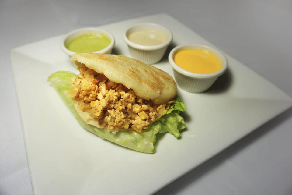 Order Arepa con Perico ( Scrambled eggs with  tomatoes and onions) food online from Griselda Restaurant El Sabor Latino store, Passaic on bringmethat.com