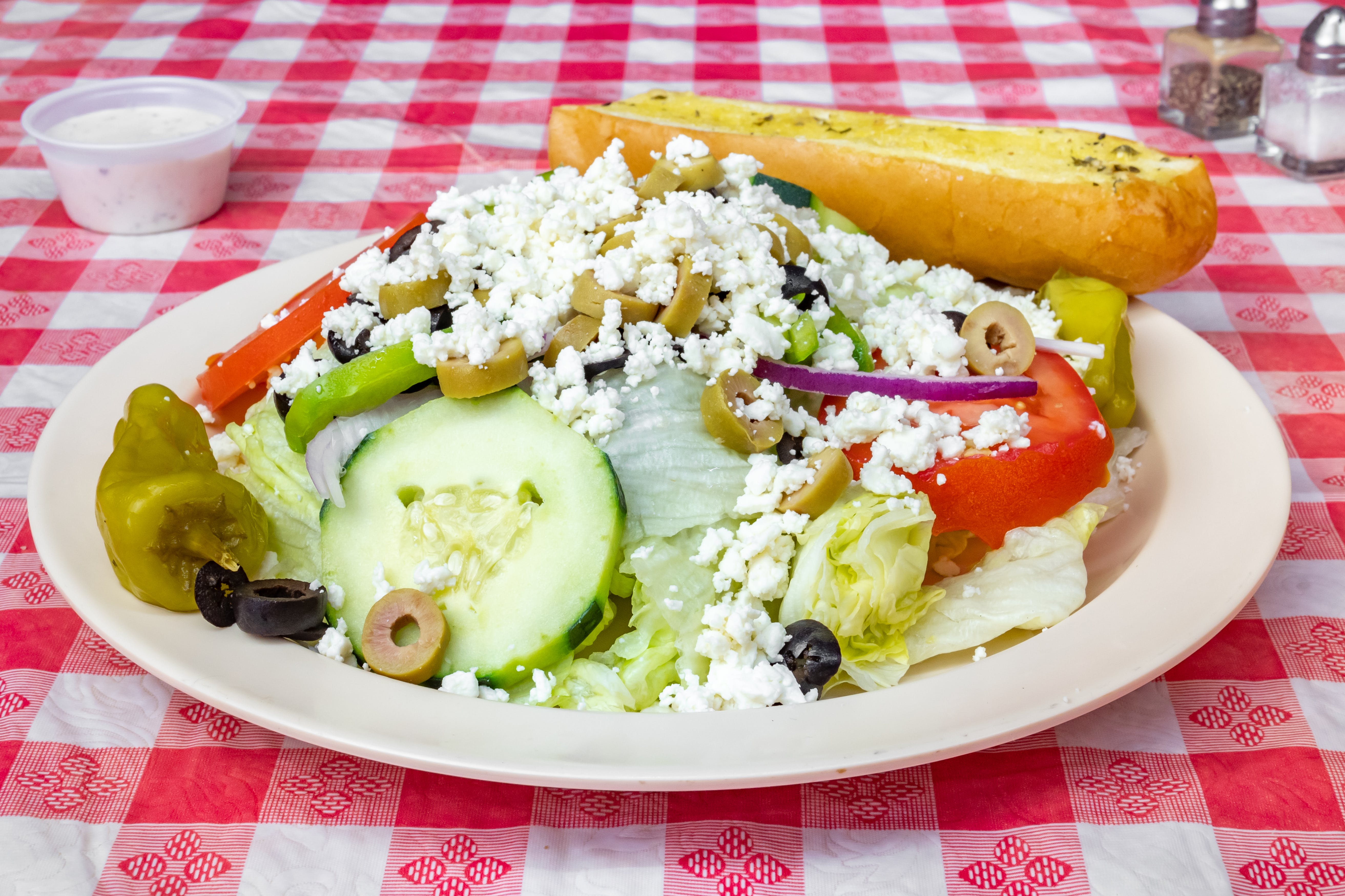 Order Greek Salad - Side food online from Firestone Pizza store, Houston on bringmethat.com