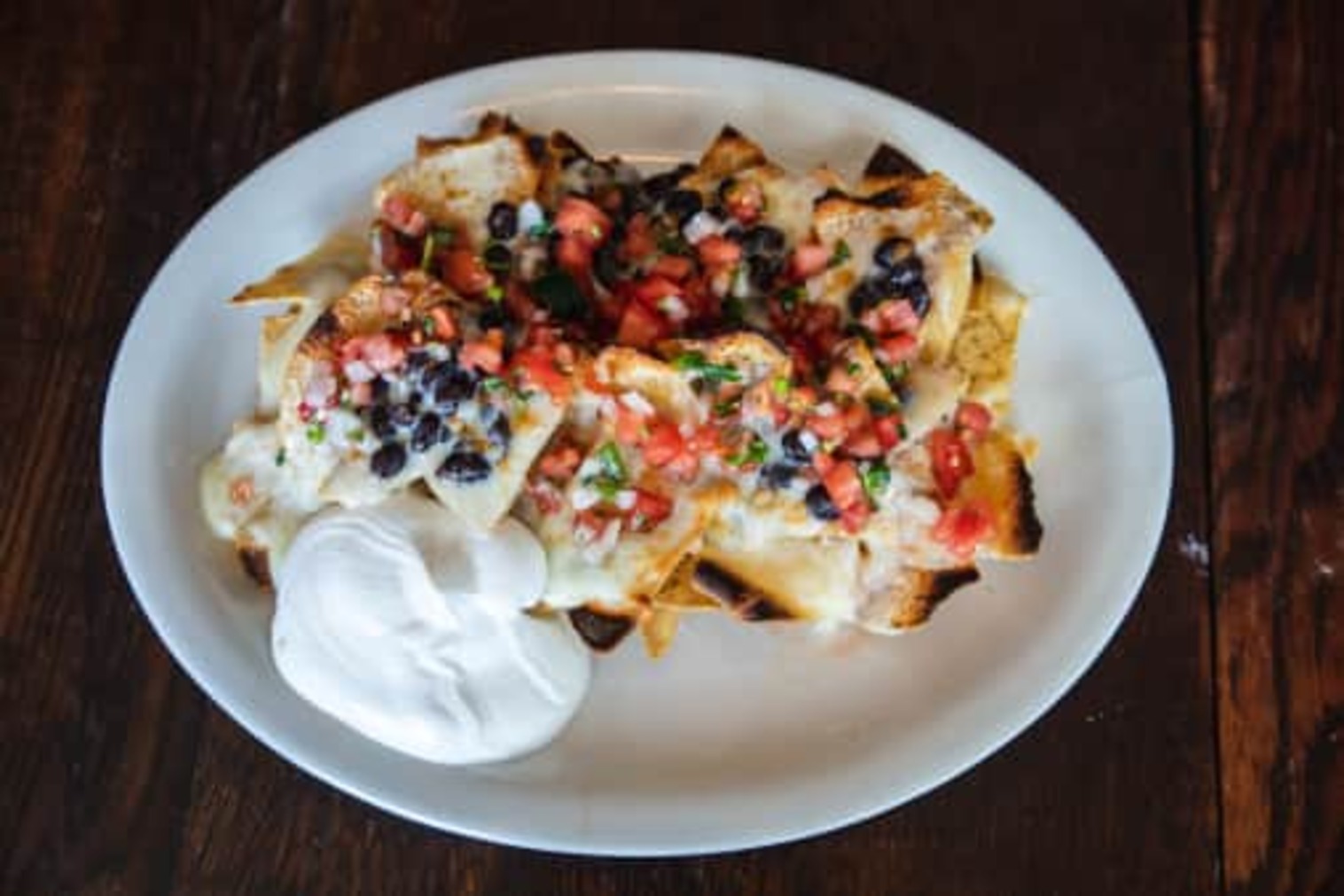 Order Nachos - small, good for 1 to 2 food online from La Veracruzana Mexican Restaurant store, Amherst on bringmethat.com