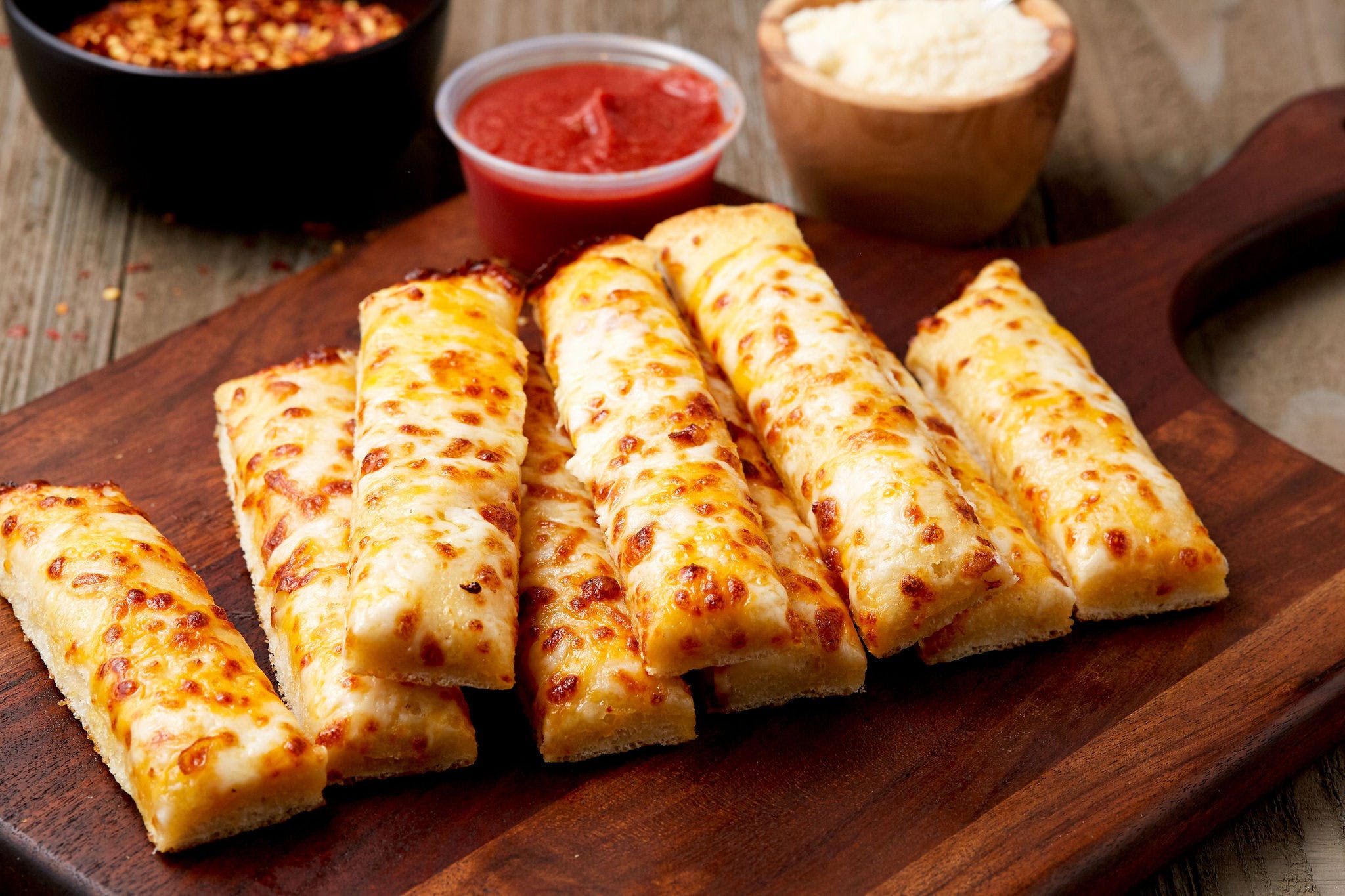 Order Garlic Sticks with Cheese - Bread food online from Simple Simon's Pizza store, East Bernard on bringmethat.com