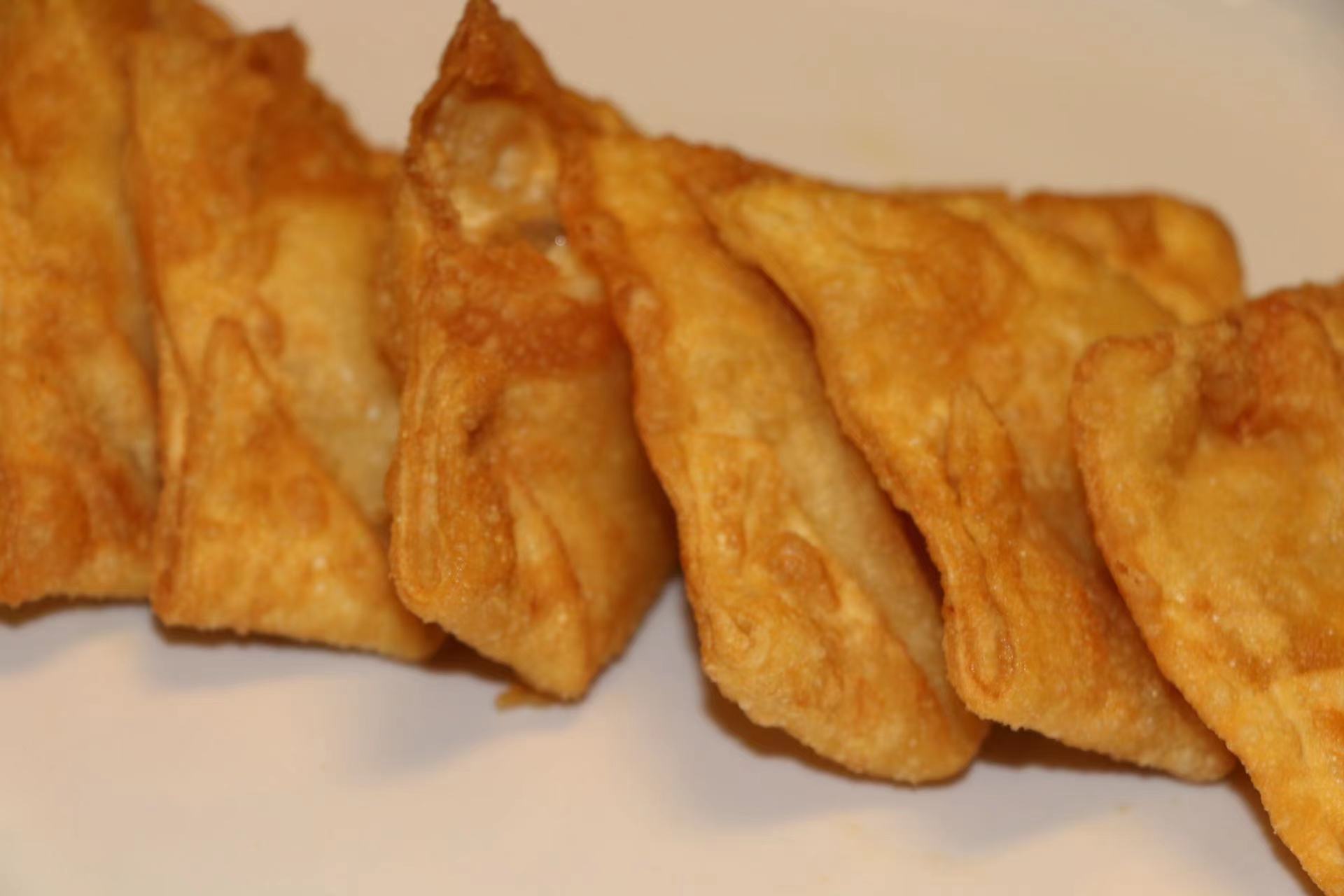 Order 03. Crab Rangoon 蟹角 food online from Yen Ching Chinese Restaurant store, Naperville on bringmethat.com
