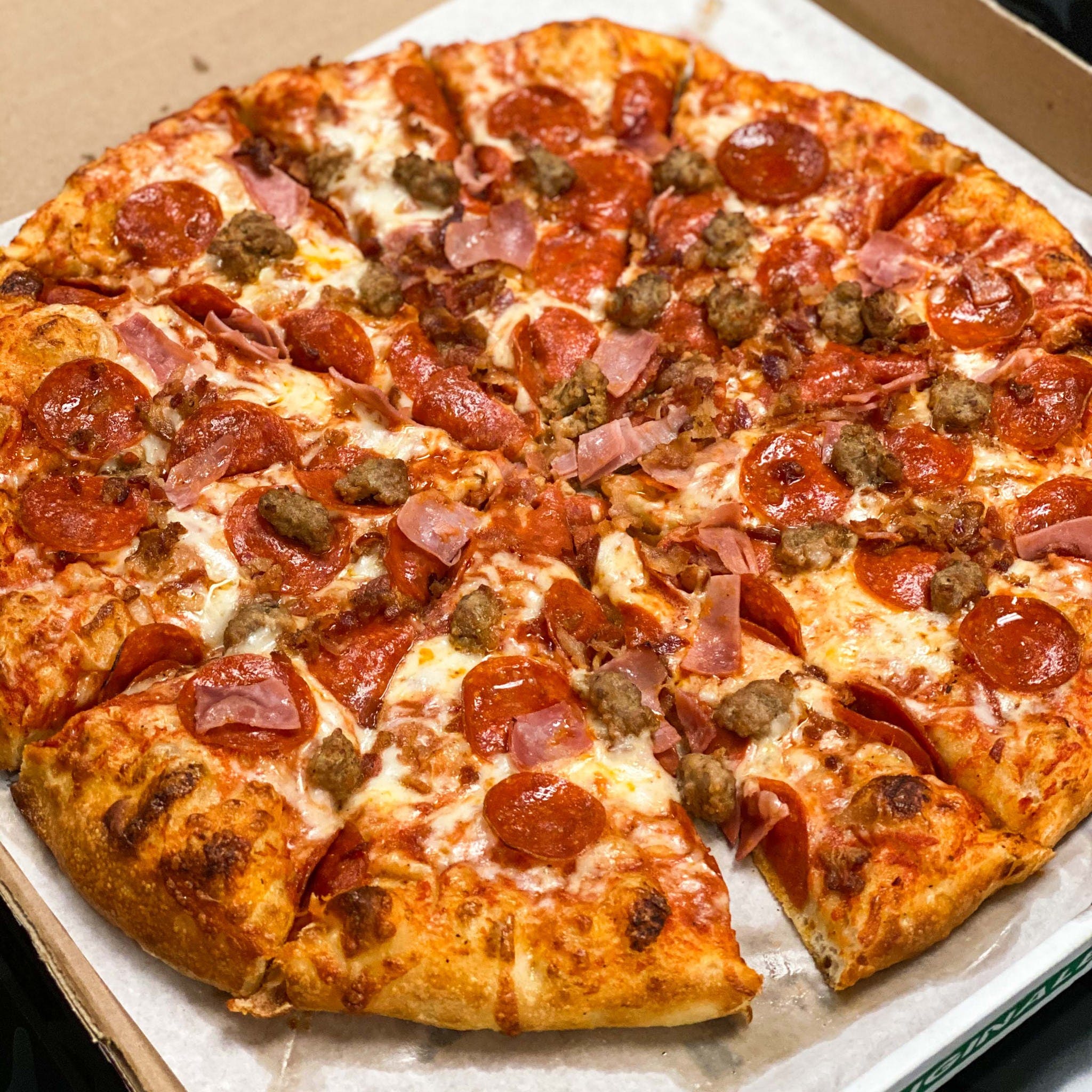 Order Round Meat Lovers Pizza - Large 14'' (8 Slices) food online from Buscemi's store, Chesterfield on bringmethat.com