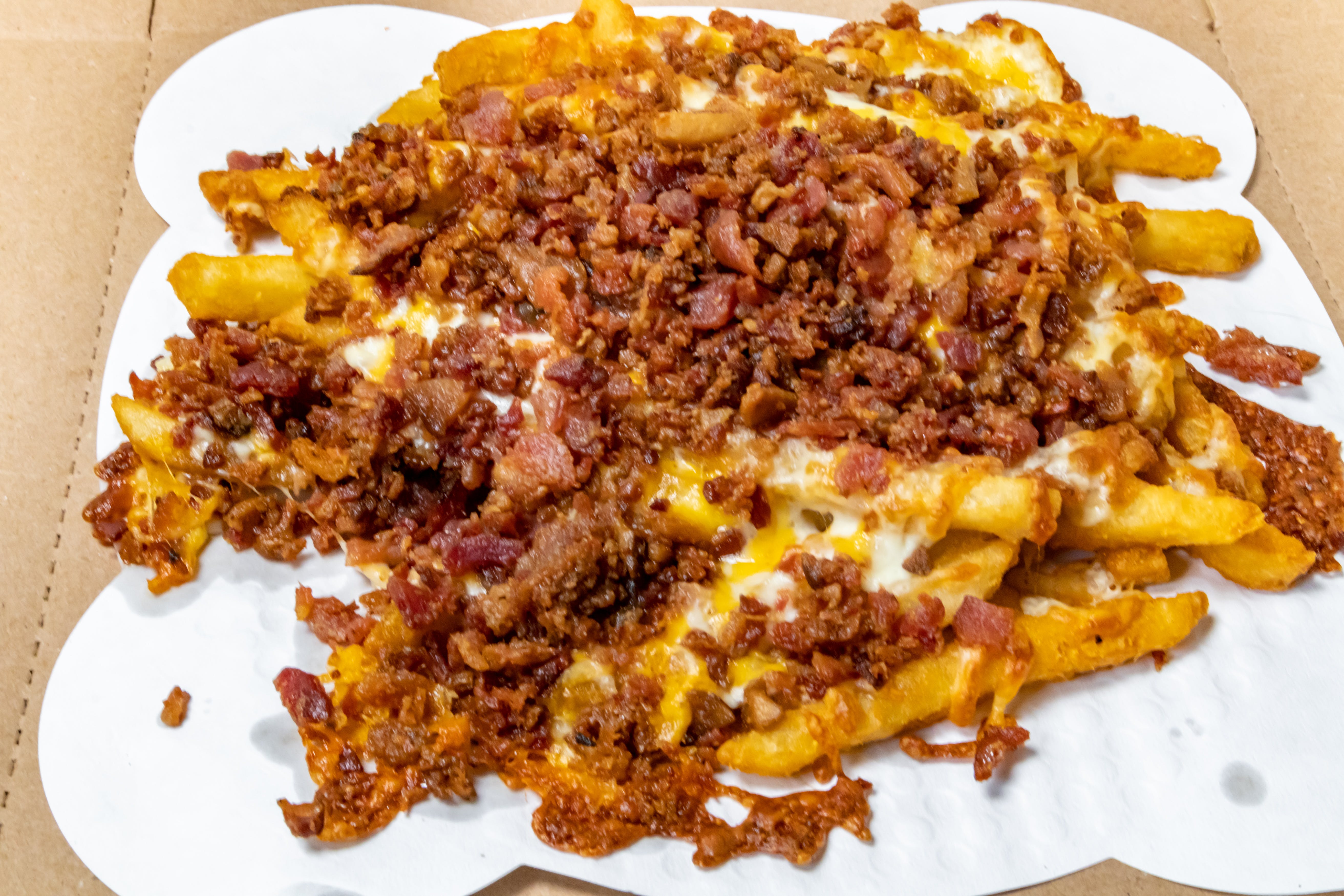 Order Bacon & Cheese French Fries - Regular food online from Novotny's Groceries & Pizza store, Worthington on bringmethat.com